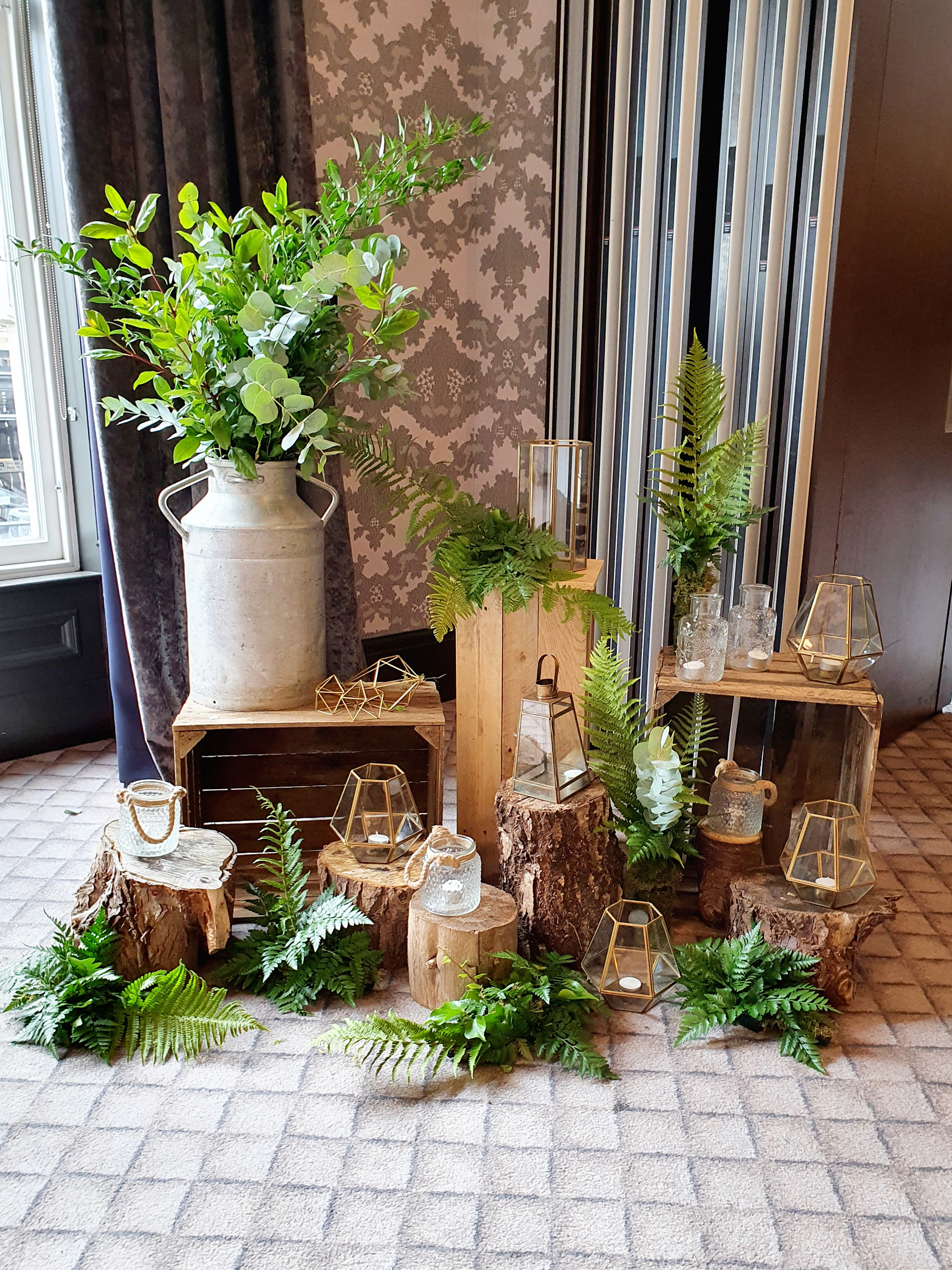 wooden crates and stumps with foliage and lanterns