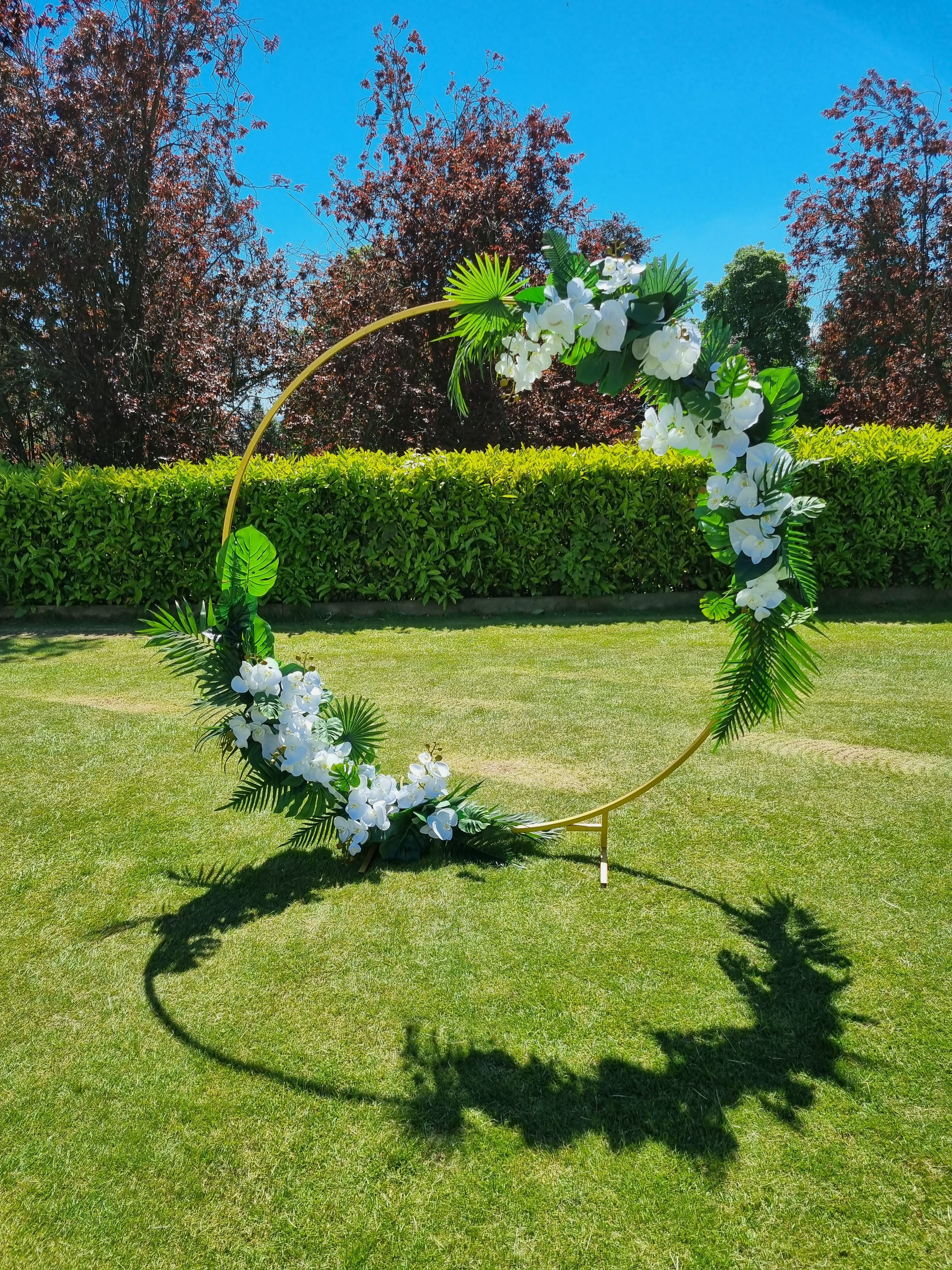 Tropical moongate arch, white flowers including orchids & anthriums