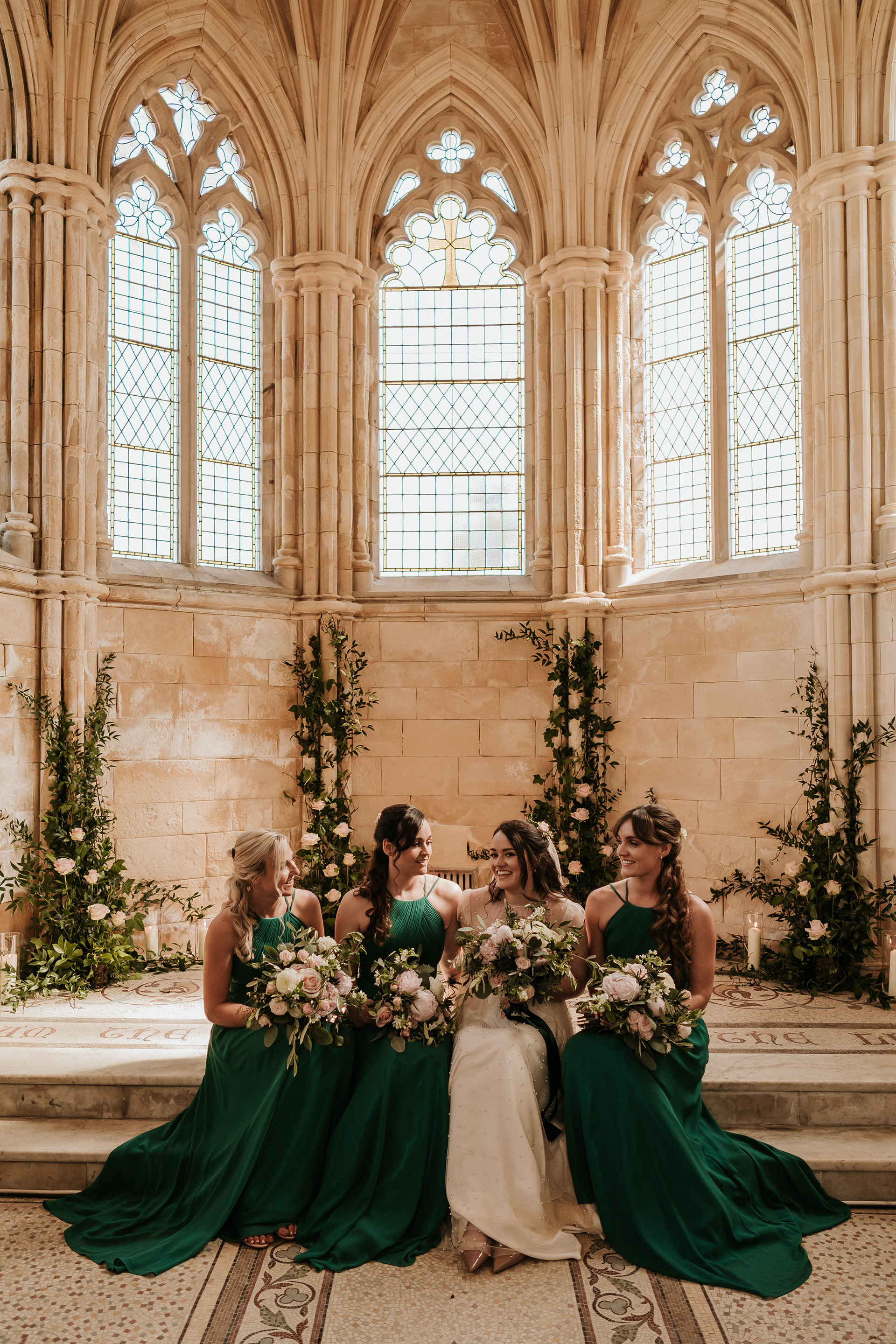 Chapel wedding with bridal party carrying bouquets