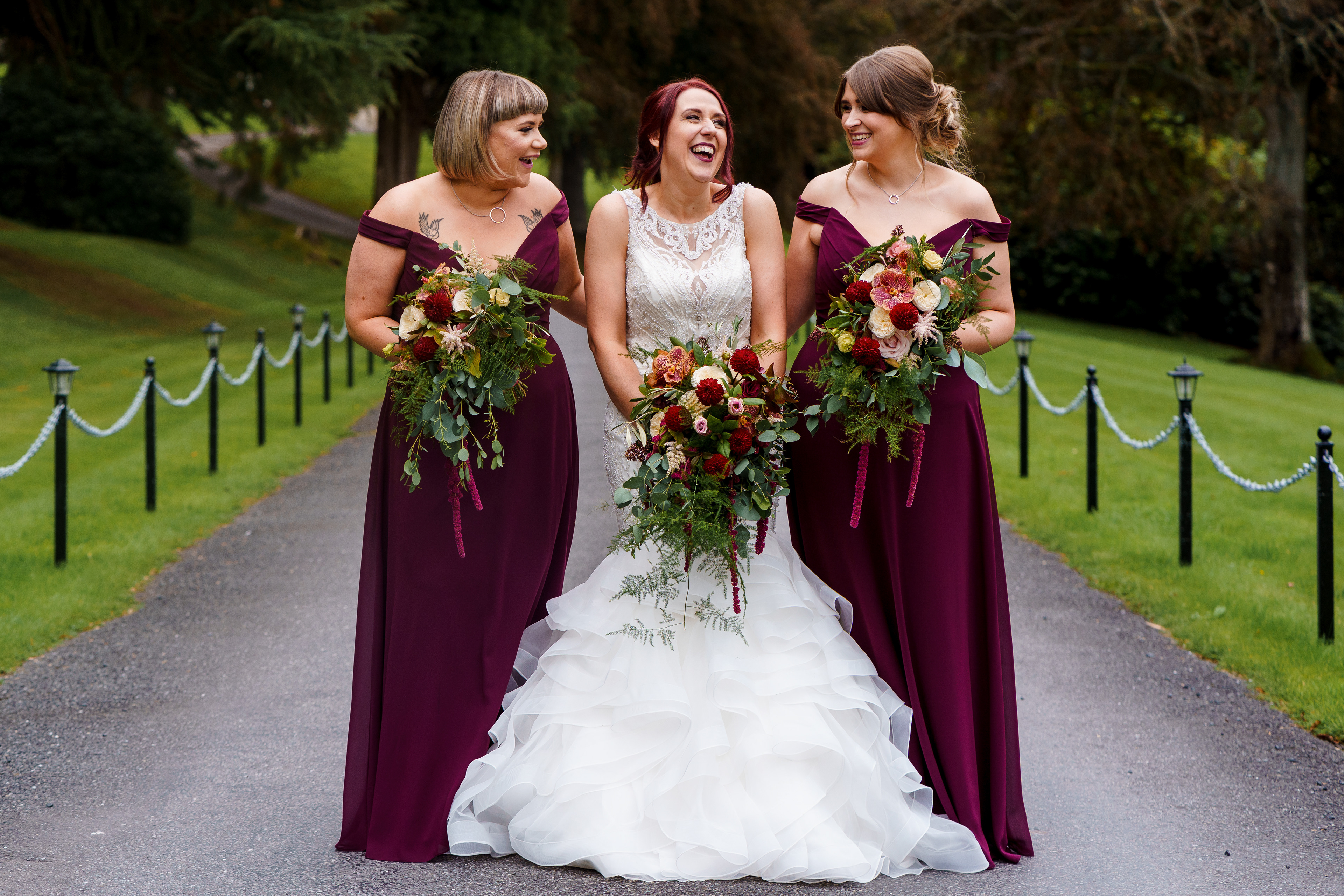 bride and maids carrying autumn bridal bouquets
