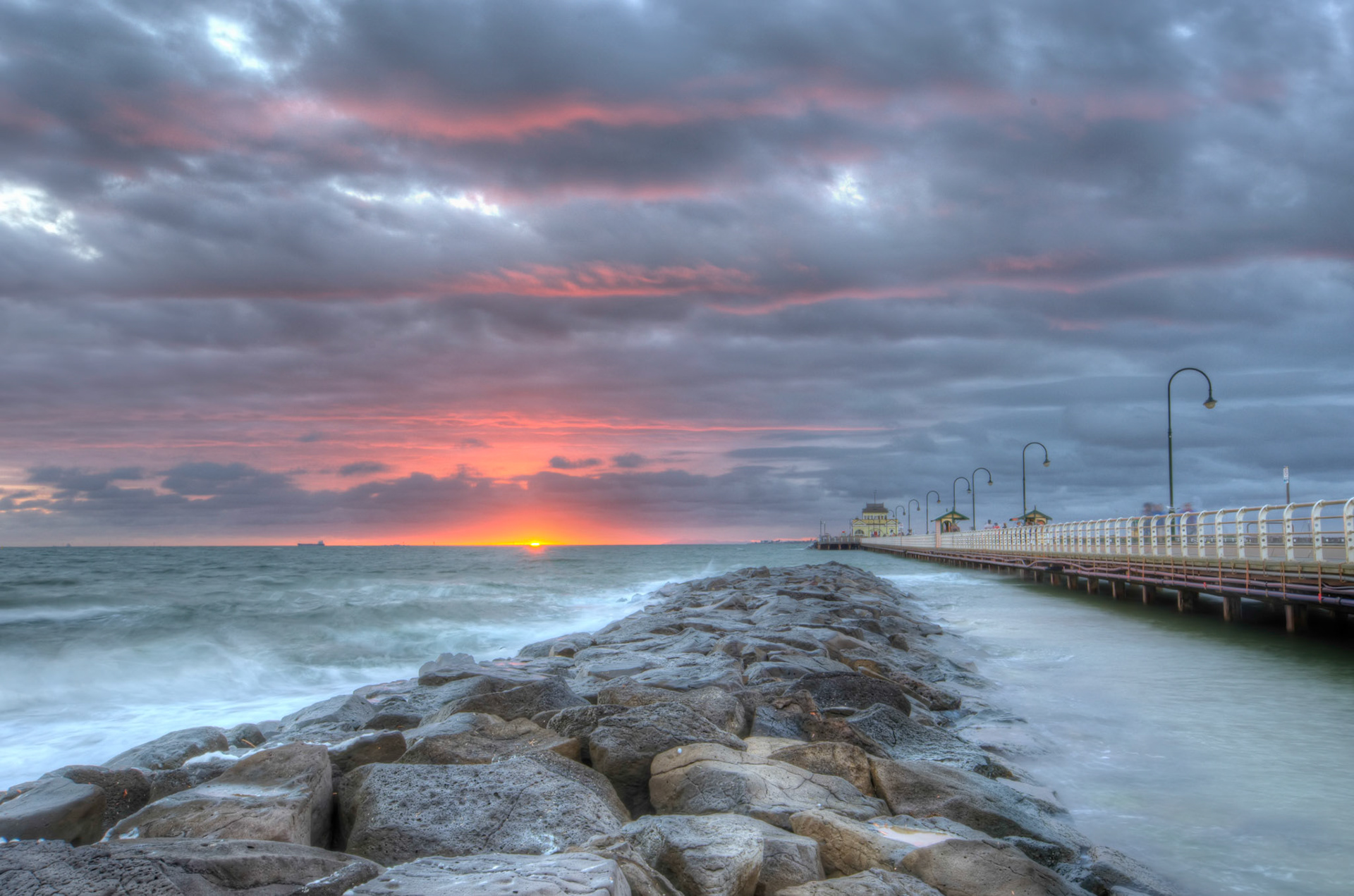 Melbourne, Australia - During the summer months the sun actually sets over the water at St. Kilda Beach; which is much nicer than the winter as: 1) is much nicer looking, and 2) is 100% warmer.