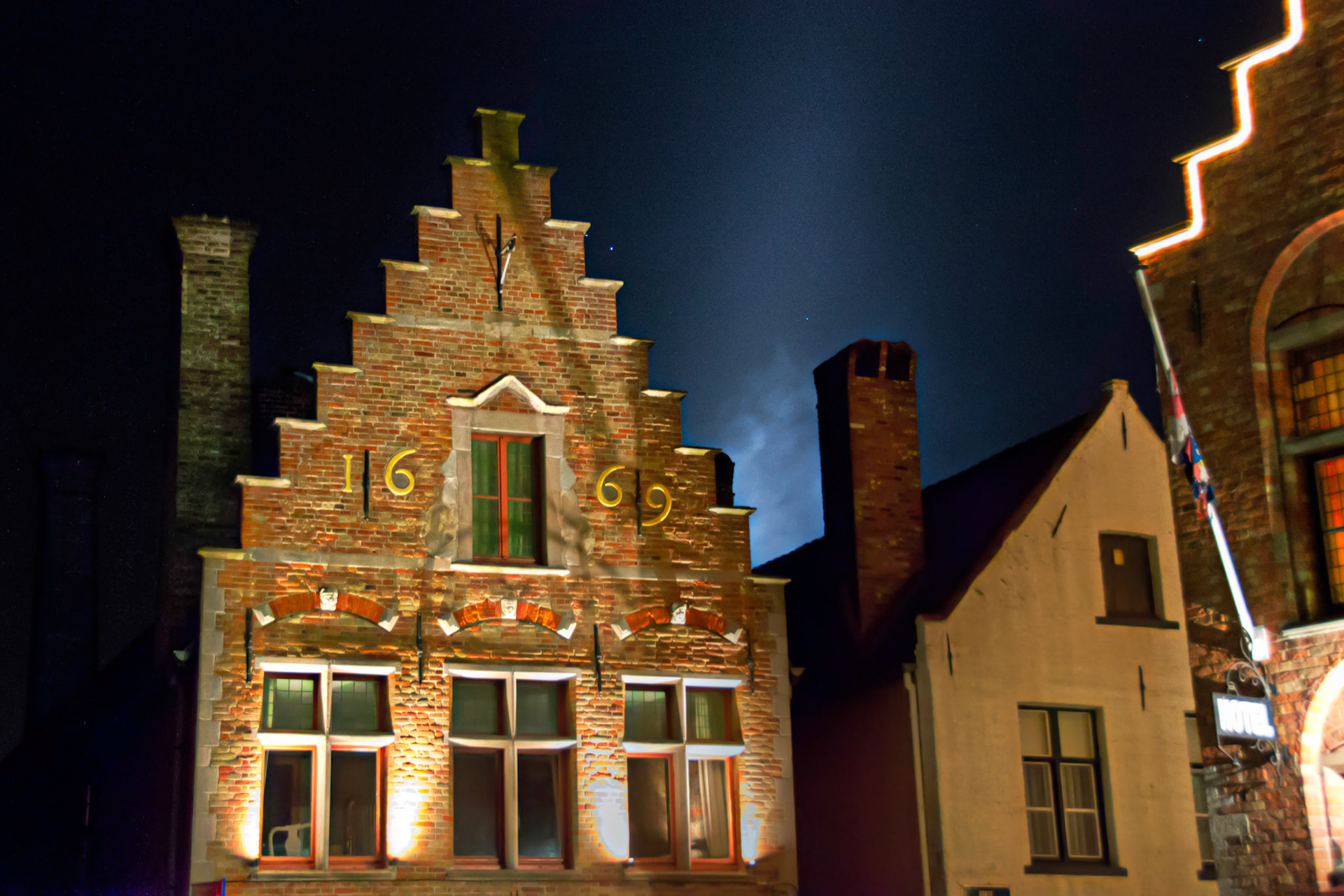 Really cool light shining behind the "1669" building.  Taken while leaving 'Market square' in Bruges.