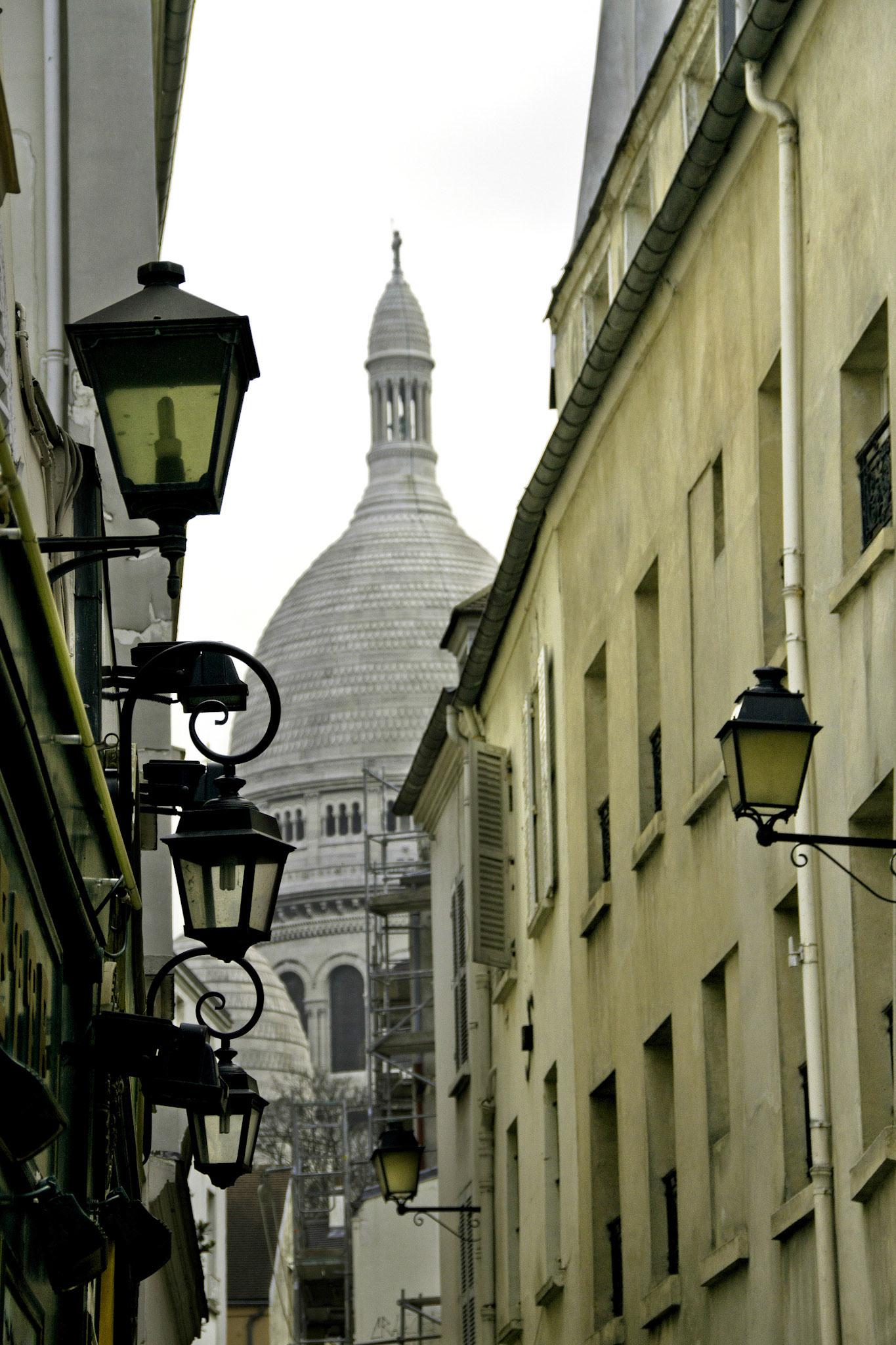View from an alley/small street in Montmartre leading to the Sacré-Cœur Basilica.