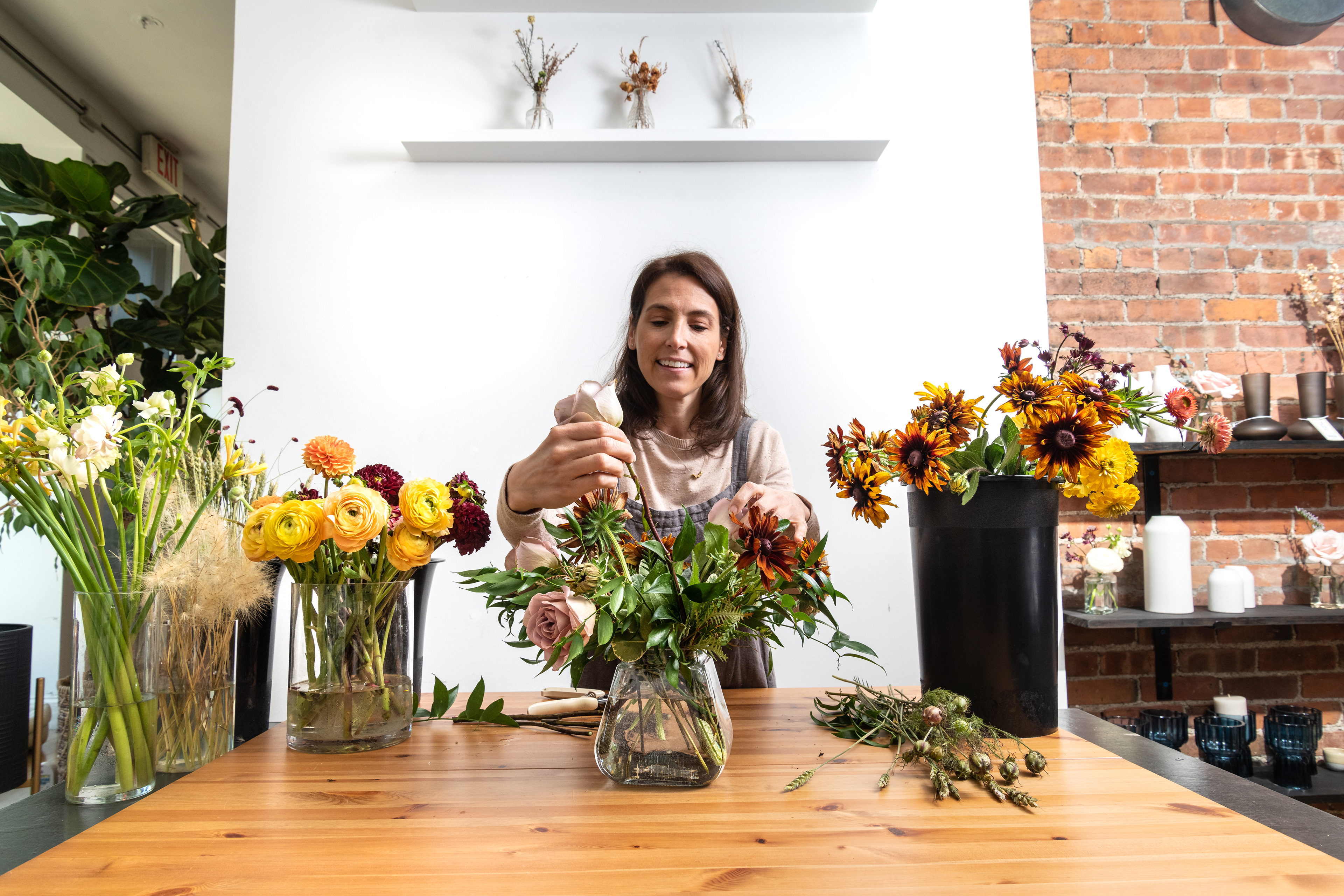 Cortney Sedor working on the floral arrangement.