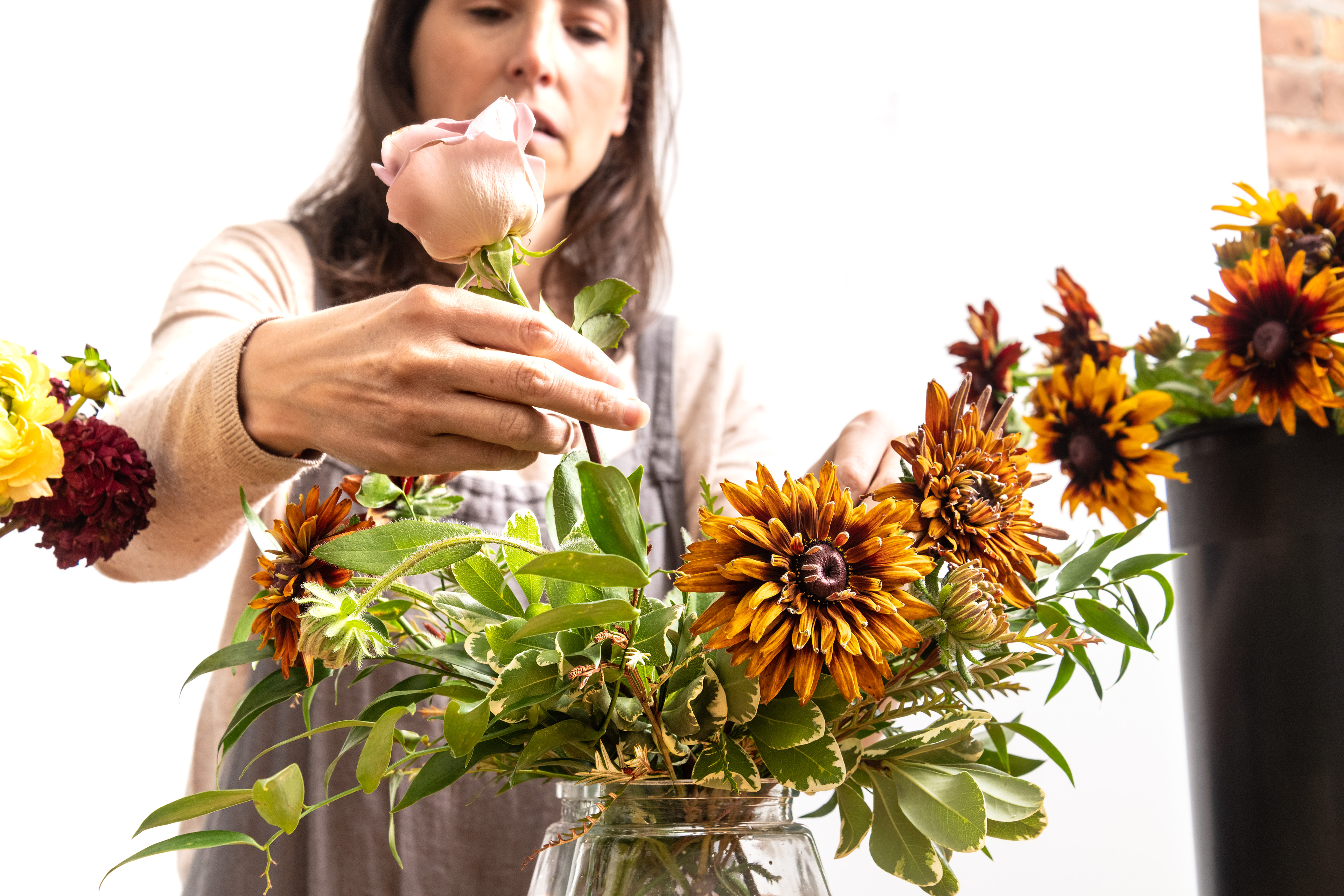 Cortney Sedor working on the floral arrangement.