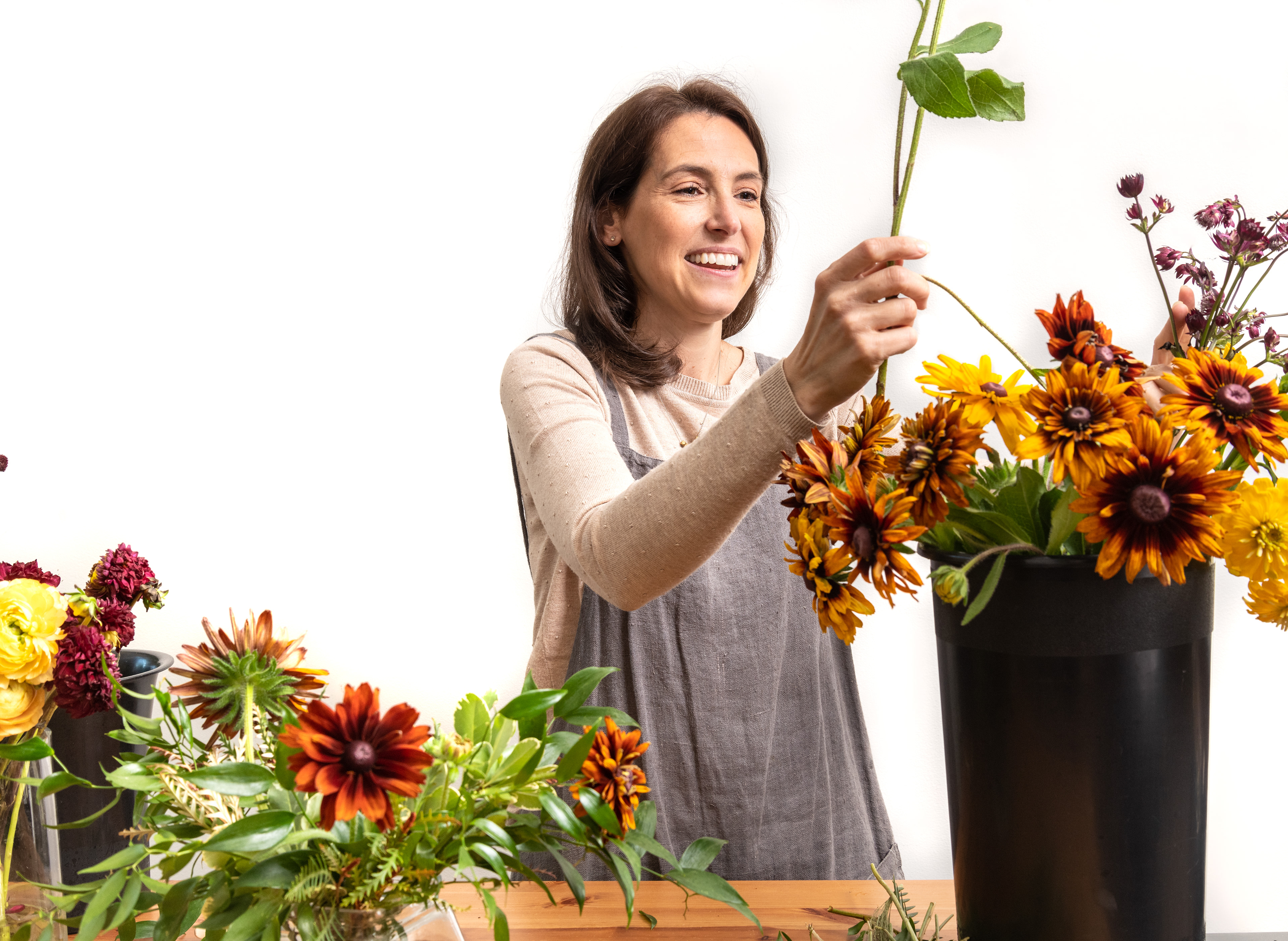 Cortney Sedor working on the floral arrangement.