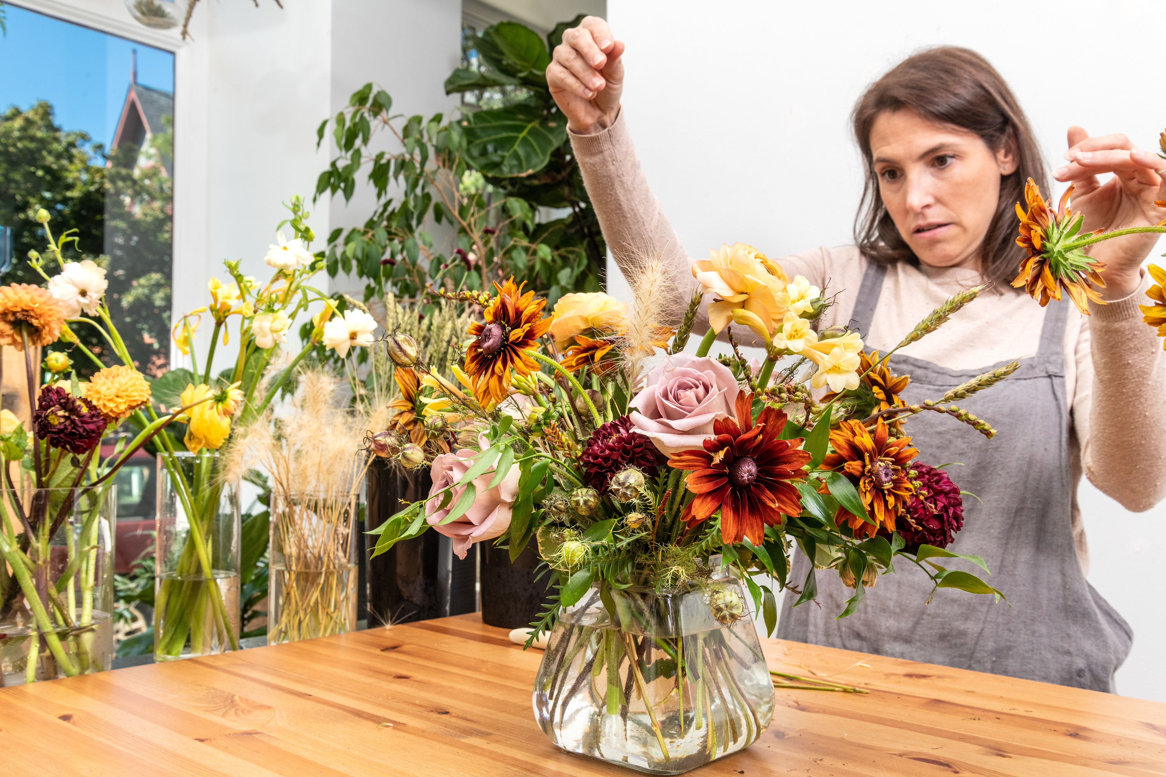Cortney Sedor working on the floral arrangement.