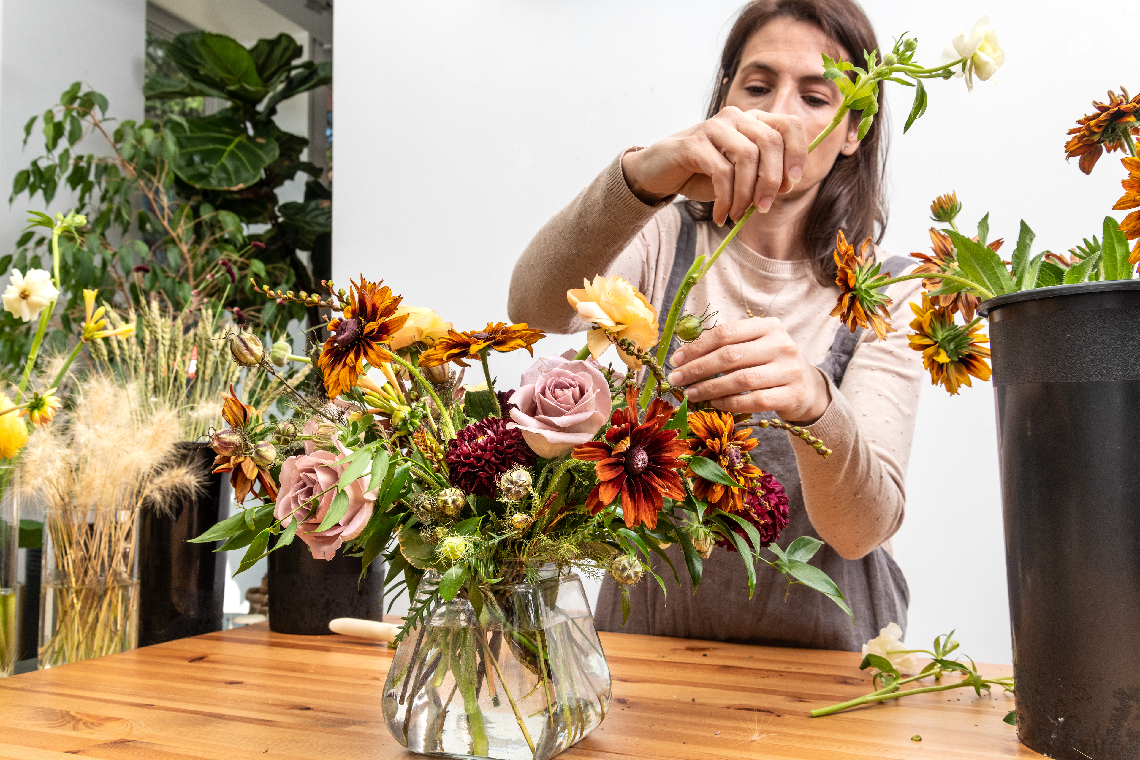 Cortney Sedor working on the floral arrangement.