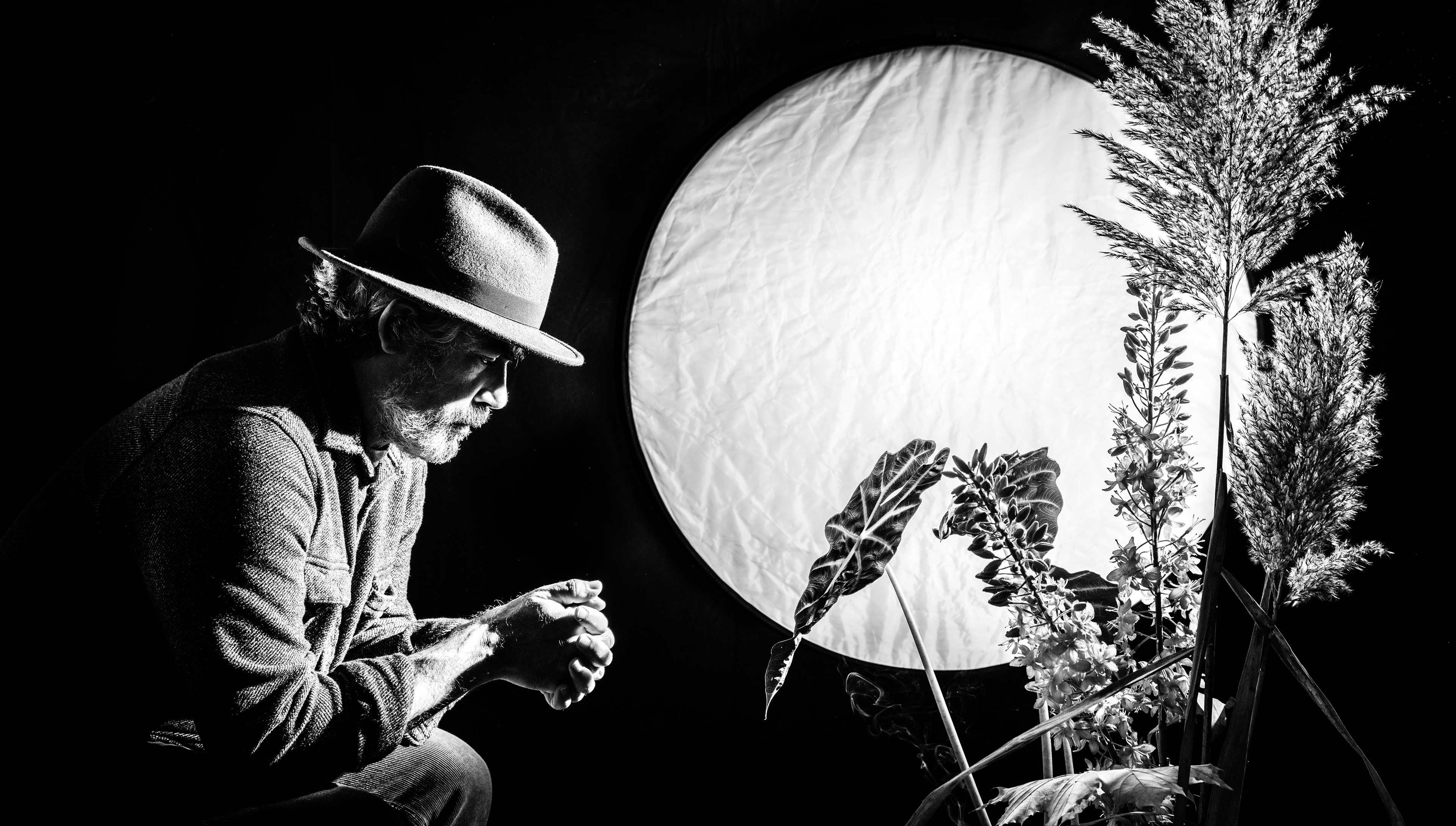 Self portrait as man sitting under a full moon and a mind full of thoughts.