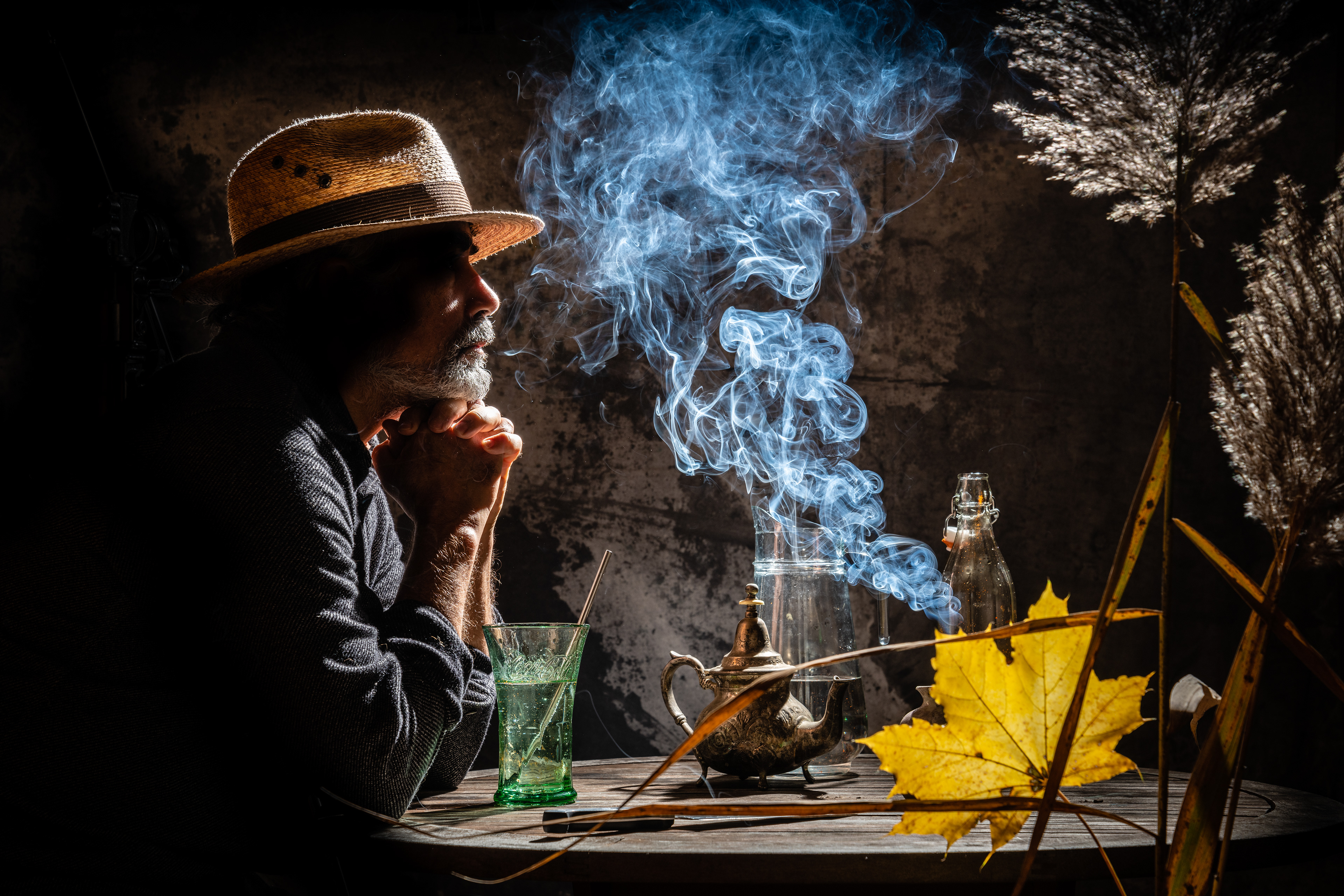 Self portraits as man sitting on a French Cafe.