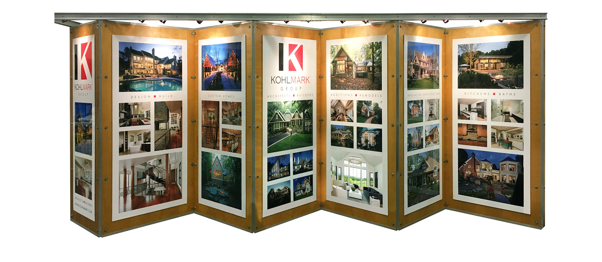 Kohlmark Group brand applications including trade show booth graphics, branded apparel, hard hats and job site signage.