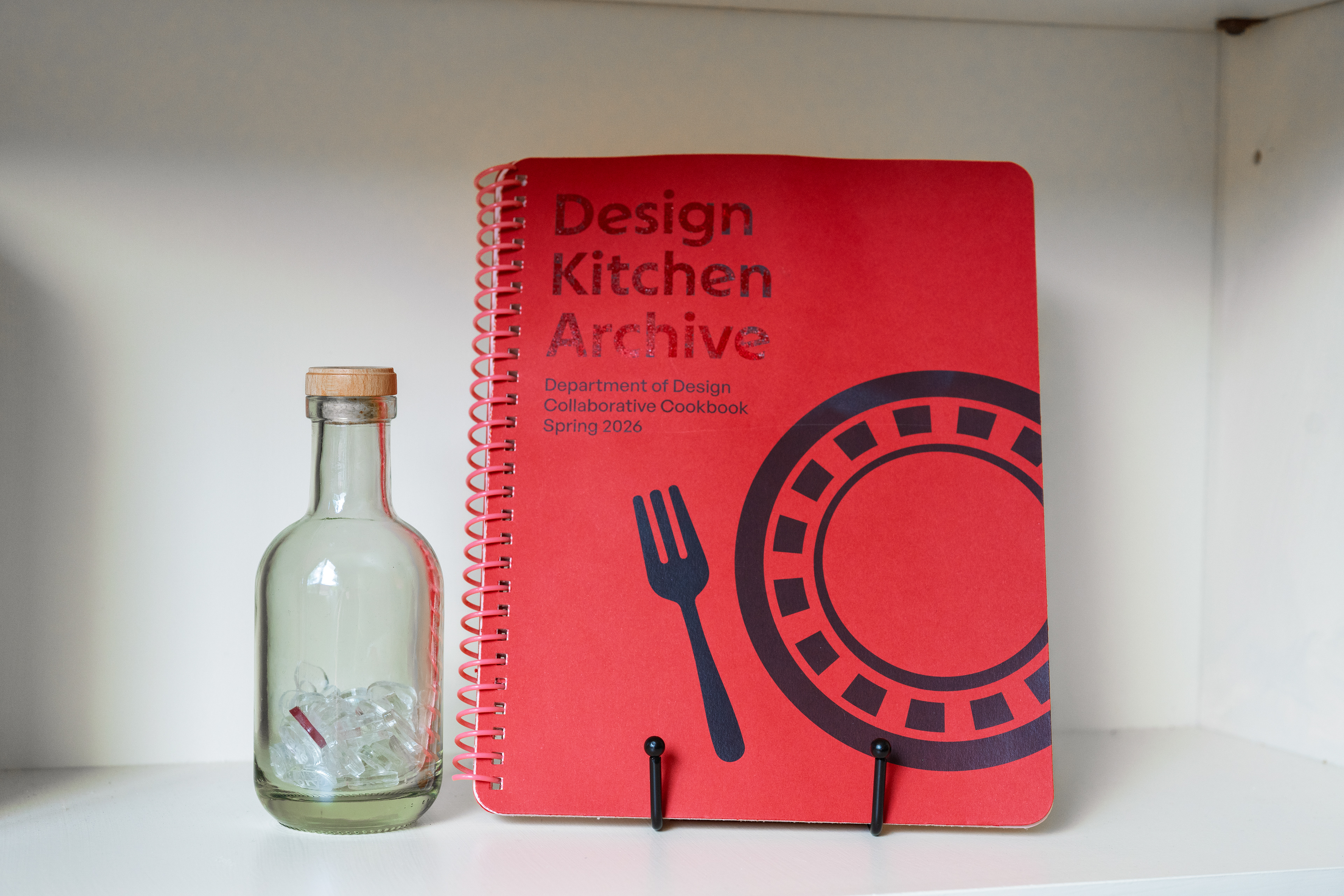 Photo of final book prototype and bottle of "seed" words.
