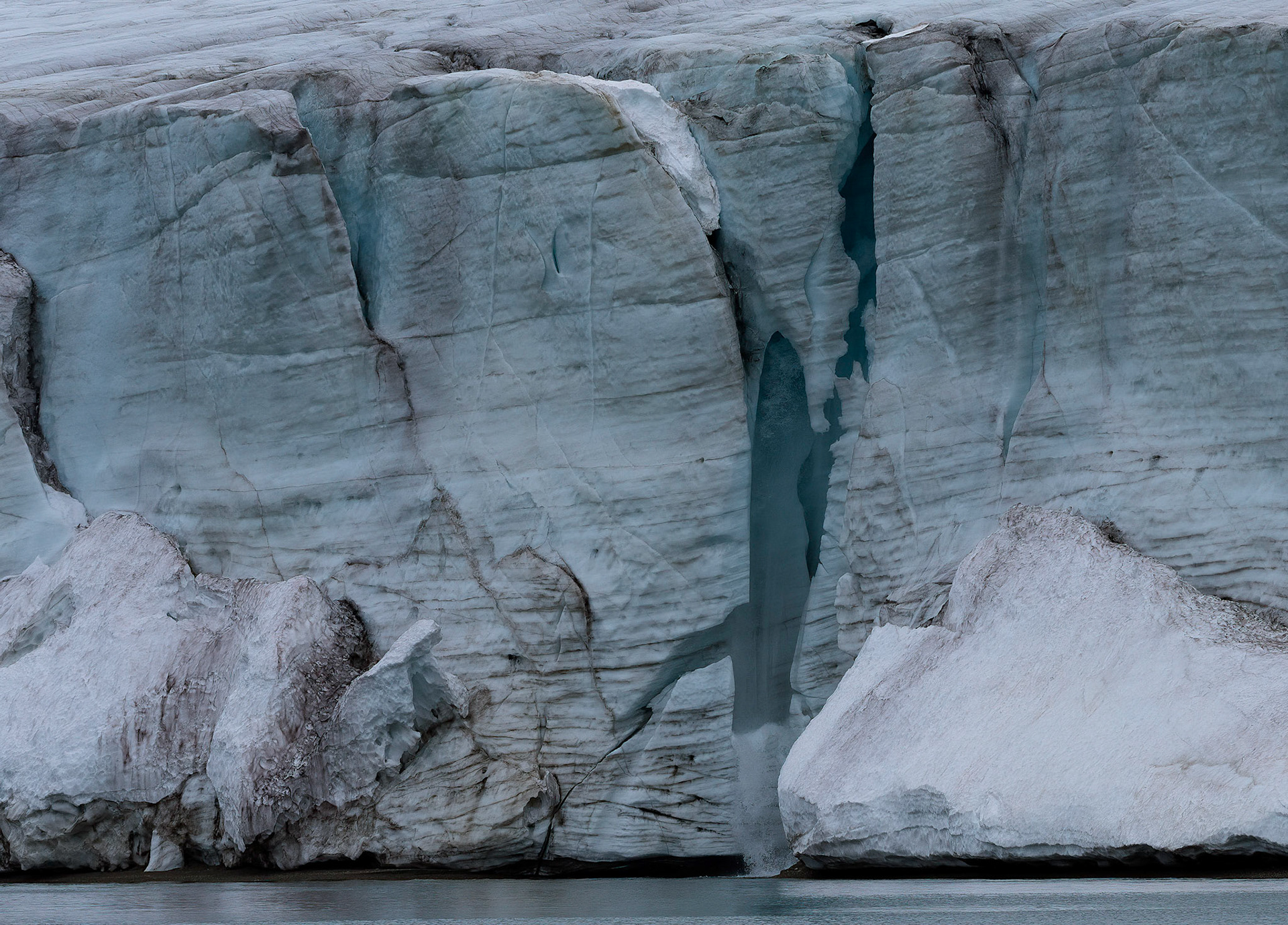 Meltwater crack on Vegafonna glacier, Svalbard. 05-08-2022.