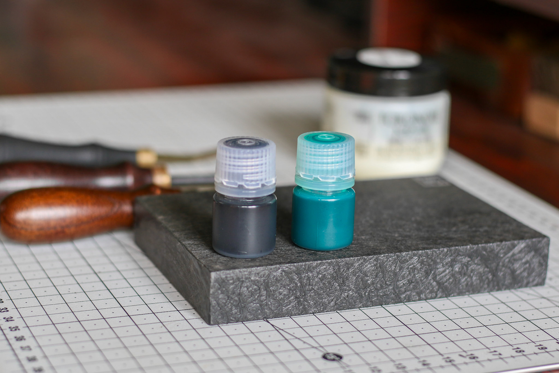 leather workshop with tools, tokonole and fenice edge paints