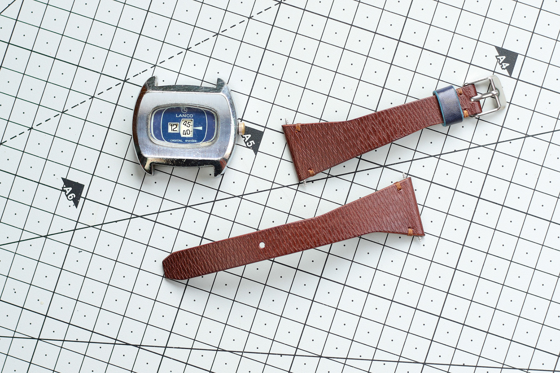 a custom 24mm strap for a vintage jump hour watch