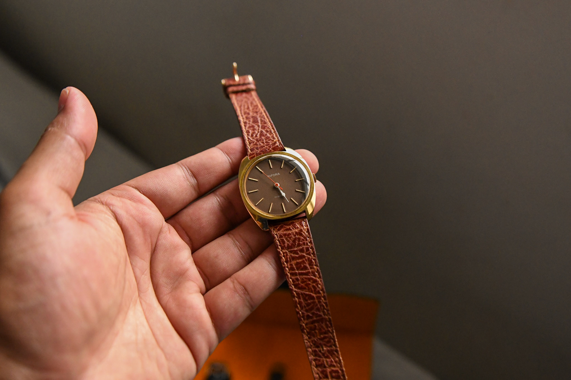 brown leather strap on a vintage dress watch with natural patina on it