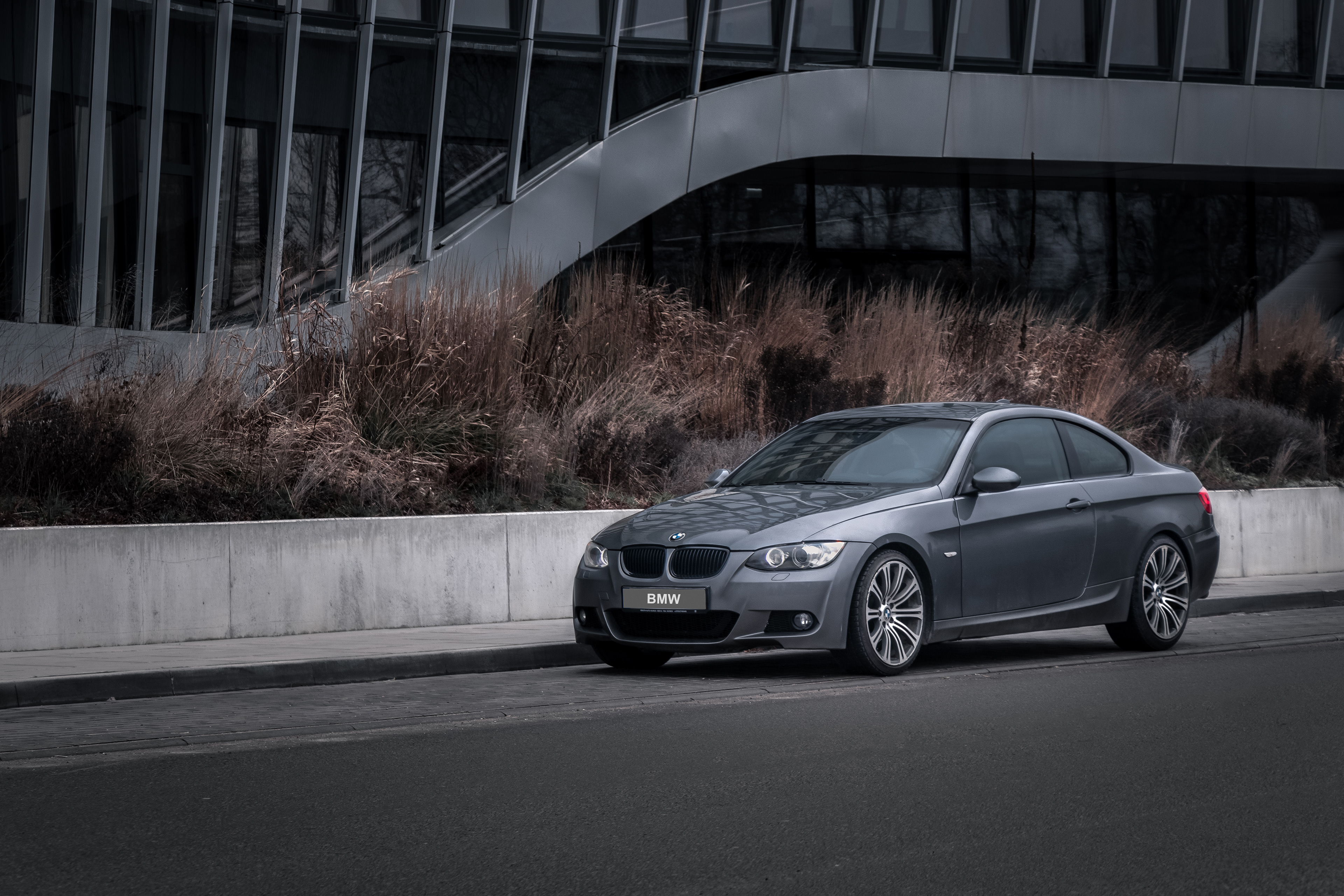 A Silver BMW E92 328i in the city car automotive photography