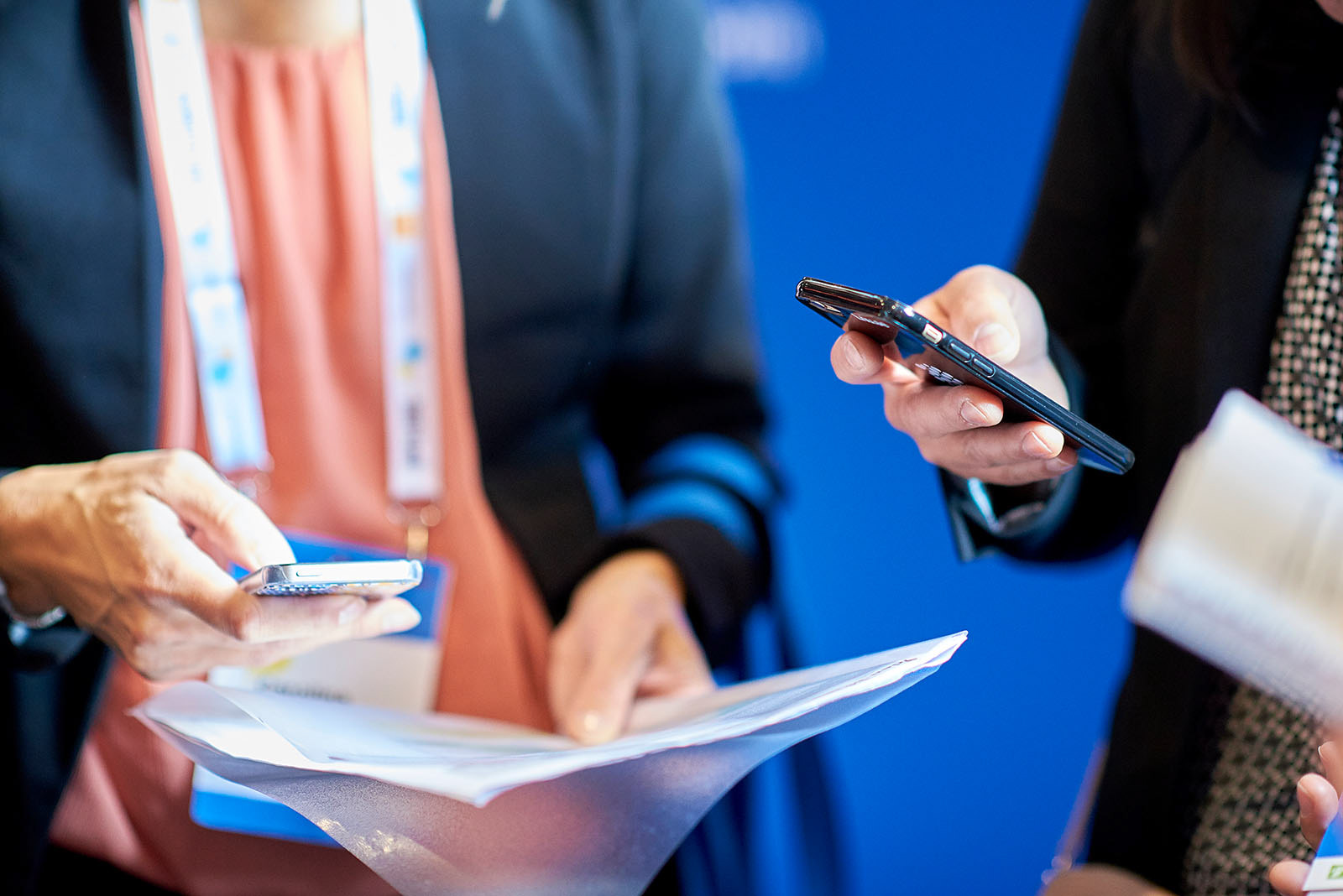 University representatives exchanging contact information.