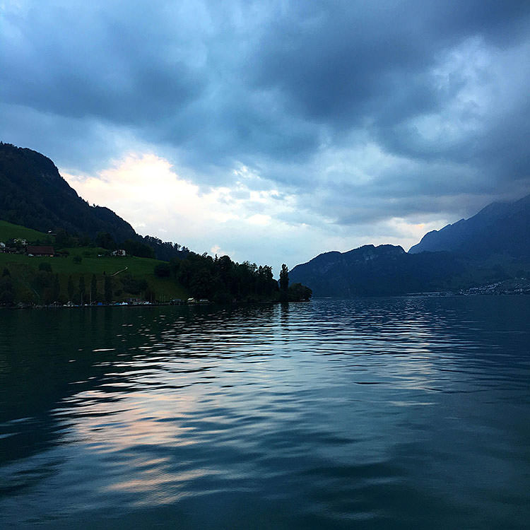 Peaceful views across the lake surrounded by the Swiss Alps.