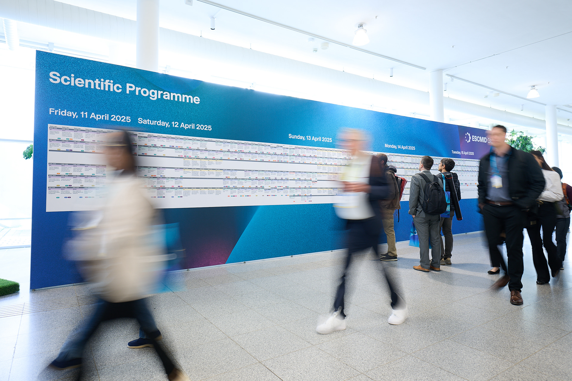 Creative long exposure photograph showing ESCMID Global 2025 attendees at VIECON Messe Wien