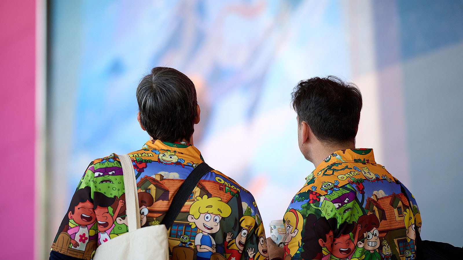 Attendees wearing branded shirts add a unique touch to the event.