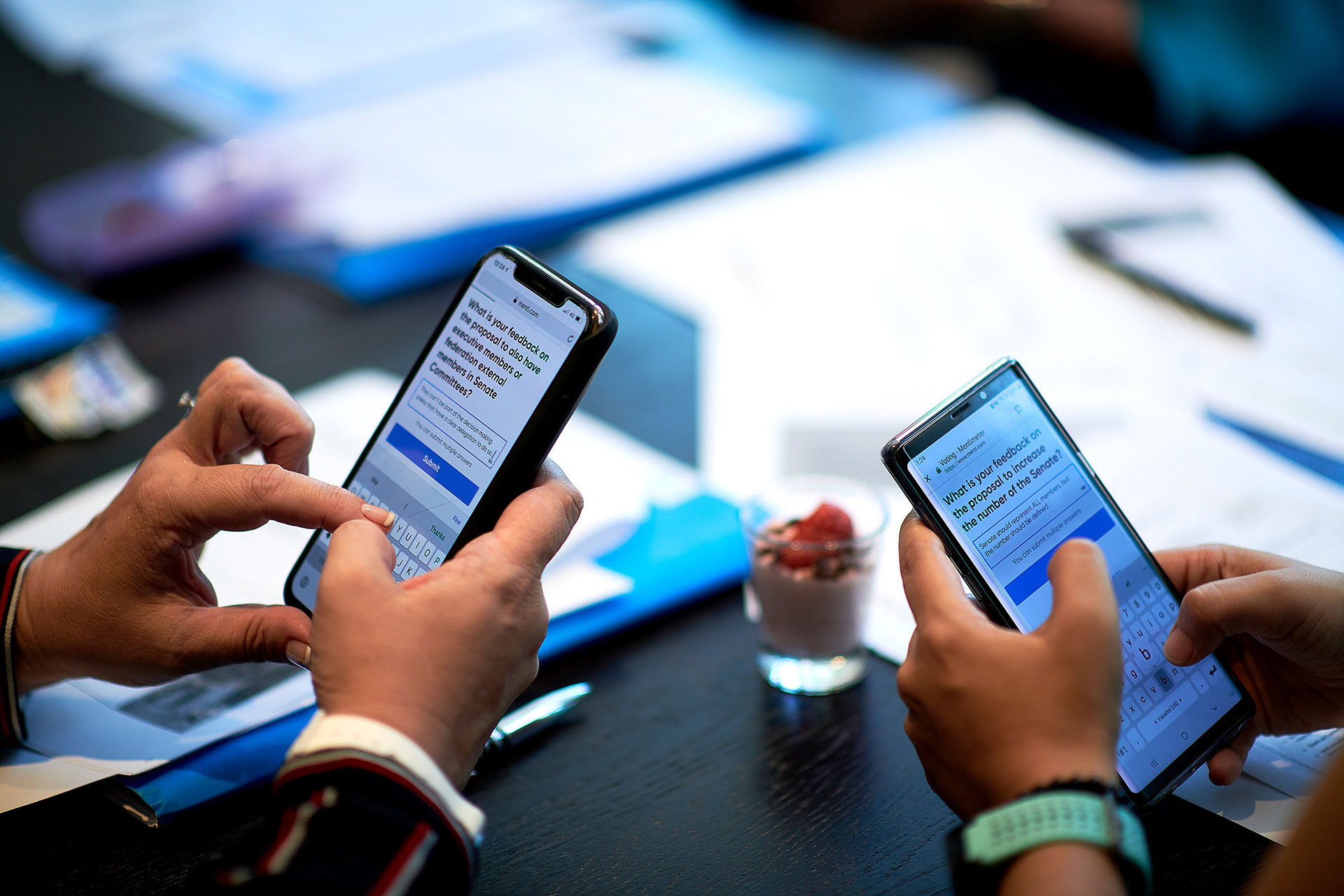 Convention attendees using their mobile phones