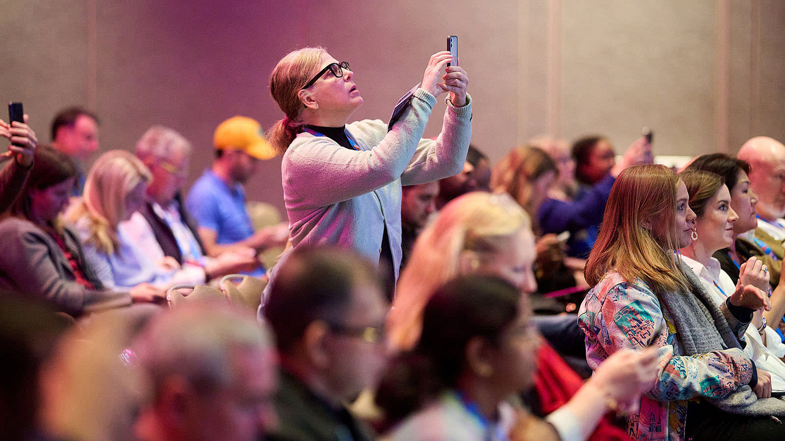 Engaged audience captivated by a session at the summit.