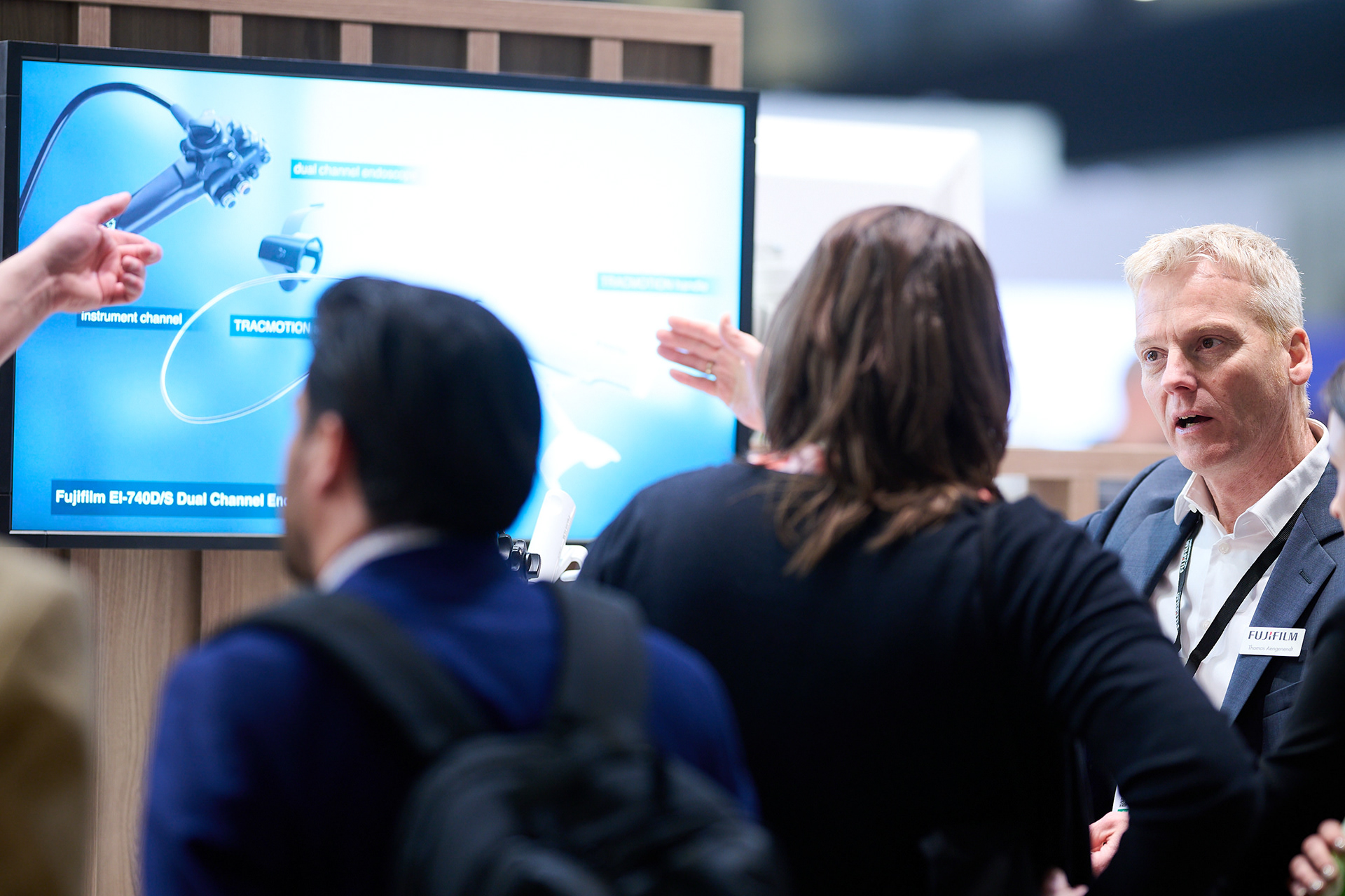 Conference visitor exploring an exhibition display at a medical trade fair in Berlin