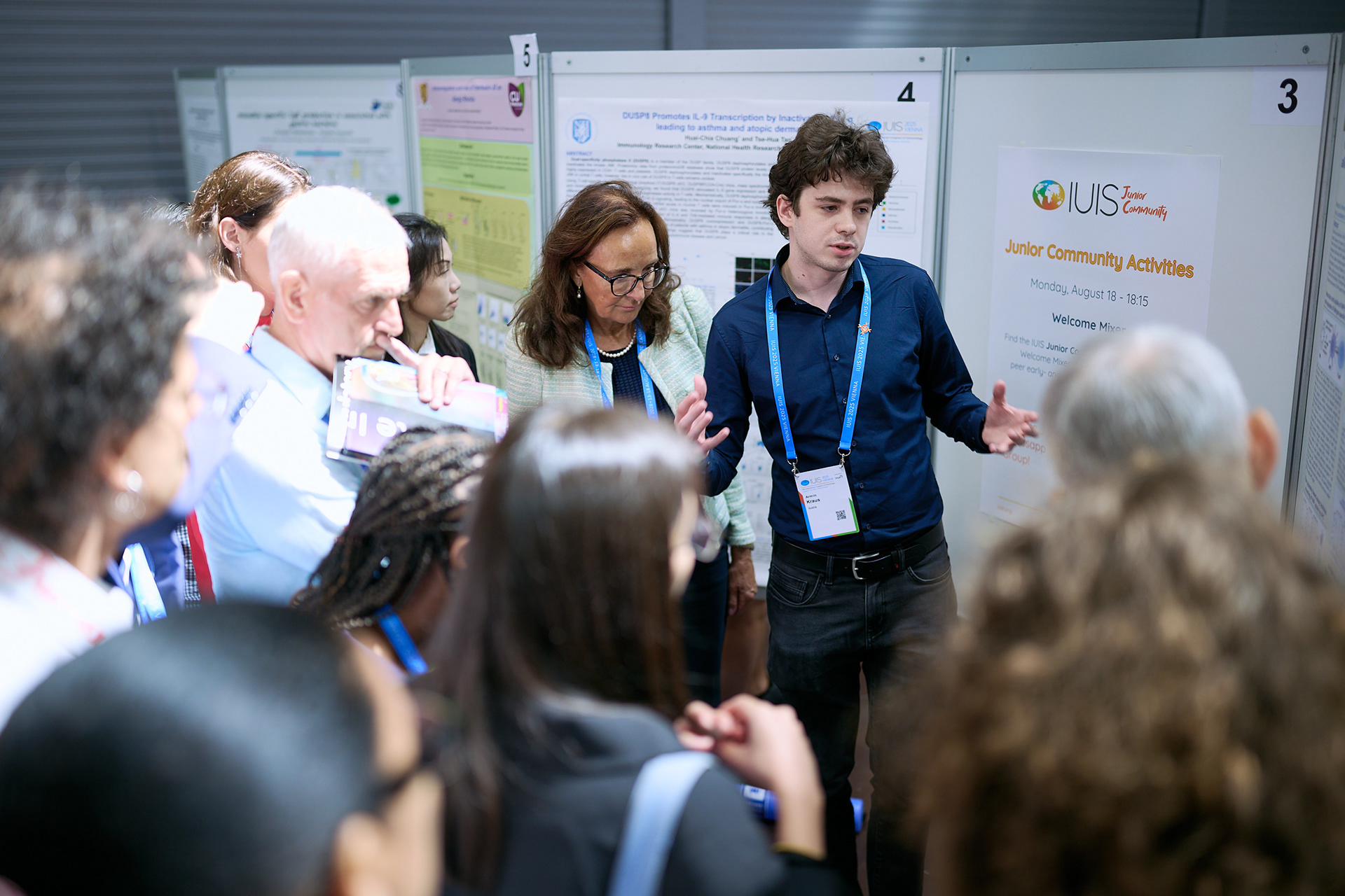 Researchers exchanging ideas during a biotechnology poster session
