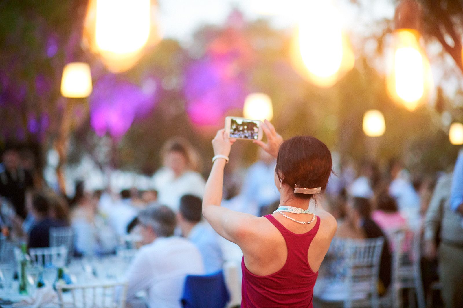 A participant taking pictures in the sunset