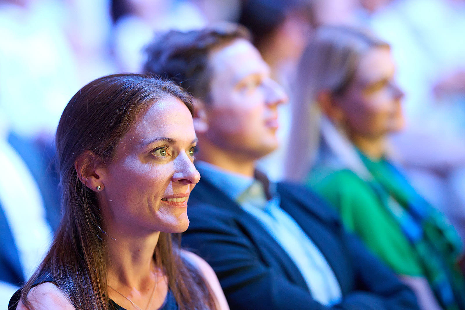 Focused participant during the conference talk.