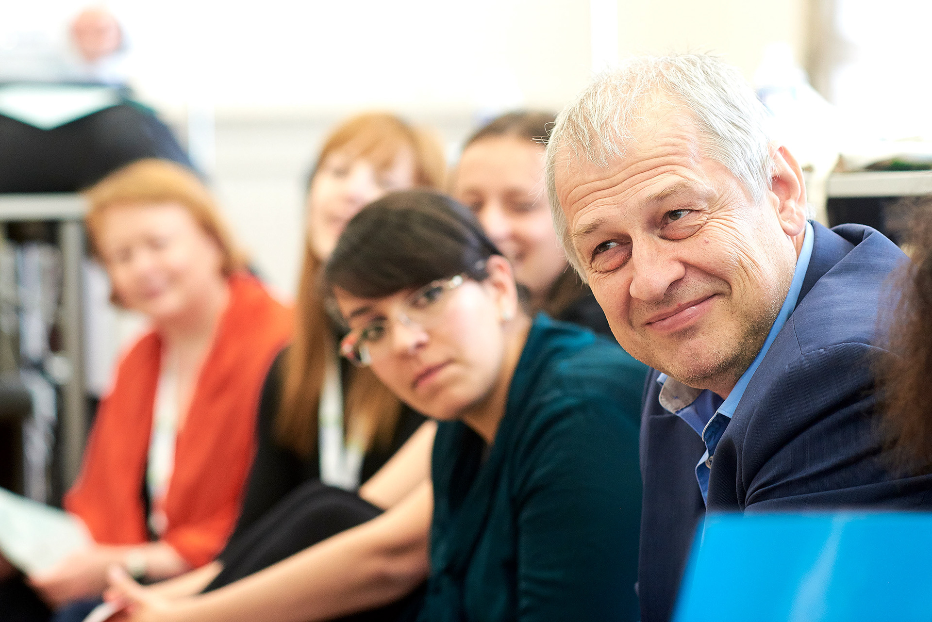 Attendees listening to a lecture. 