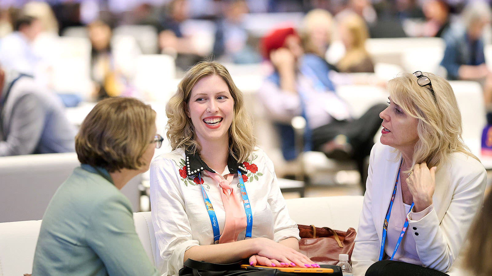 Networking moment where industry professionals exchange ideas.