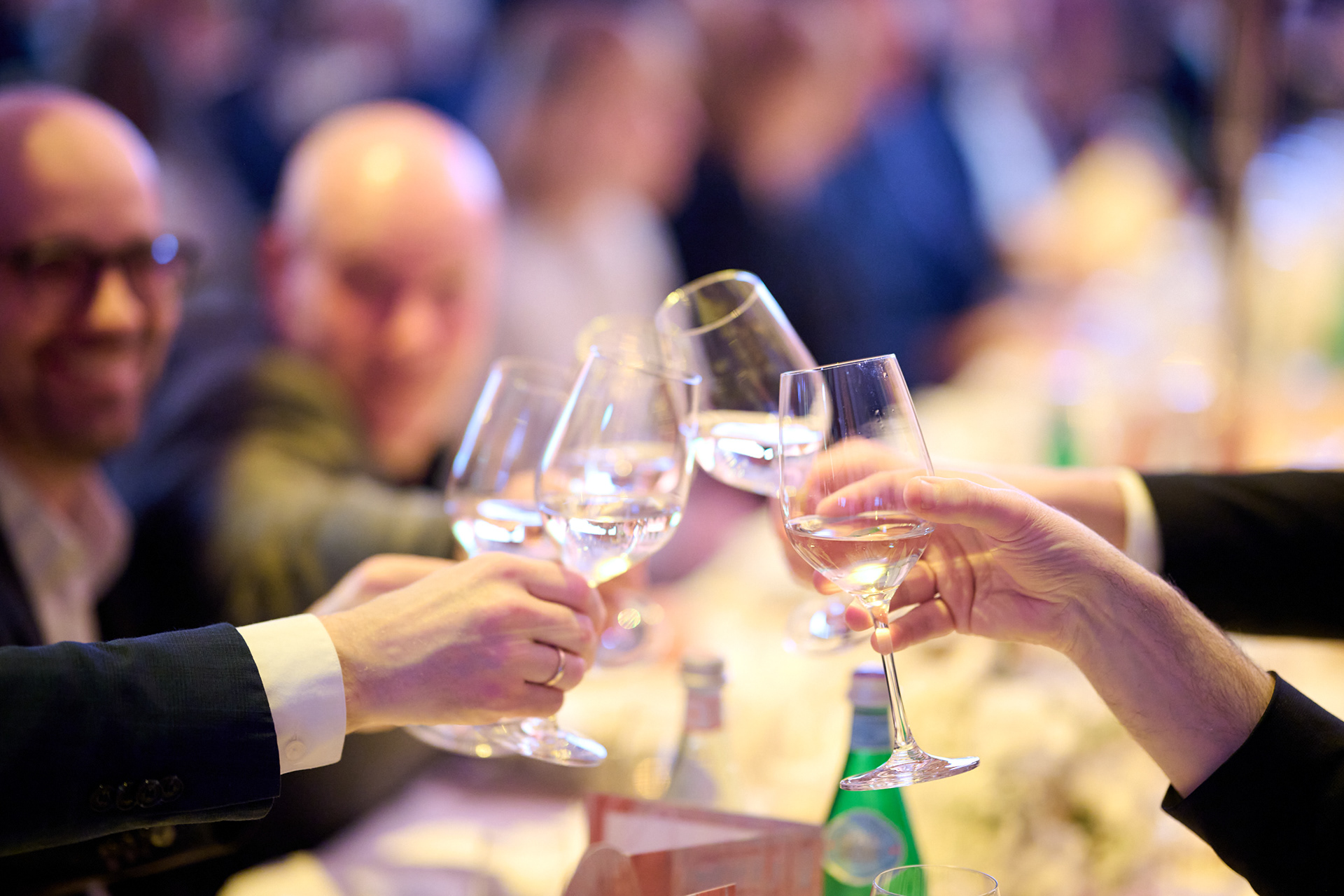 Conference delegates toasting during an evening gala dinner