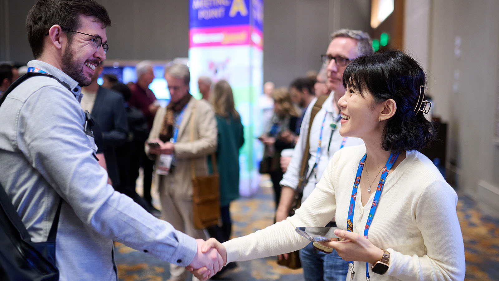 Joyful interactions as participants meeting one another.