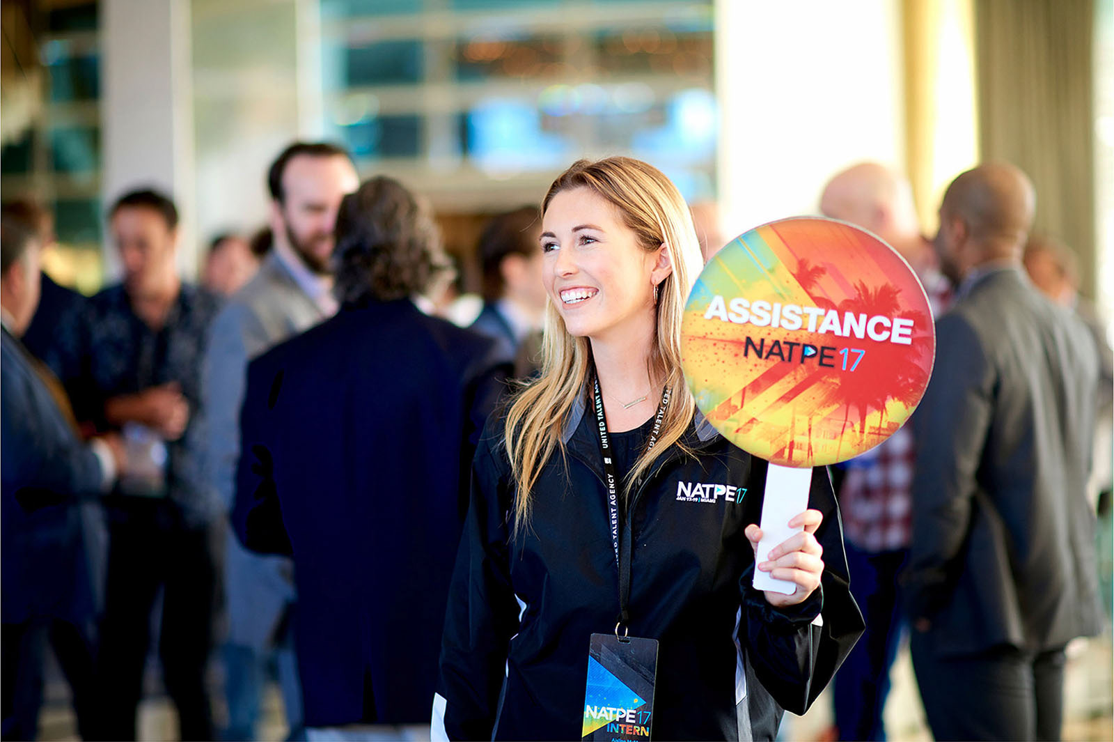 Conference assistant providing assistance.