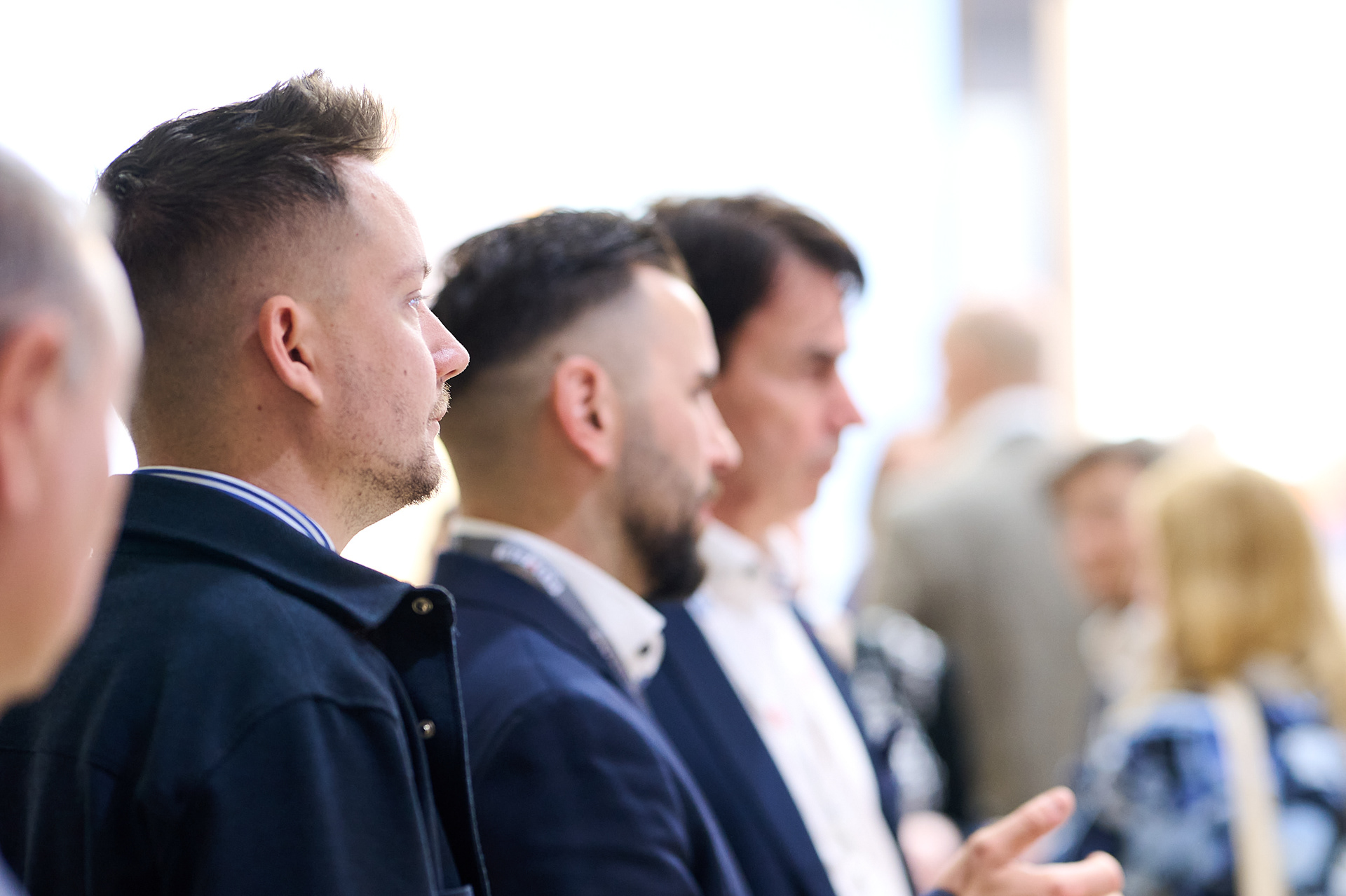 Visitors exploring exhibition booths.