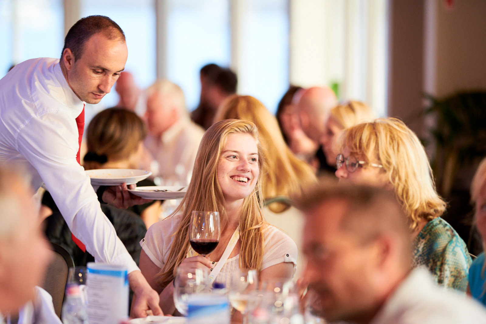 Excellent mood on board during the evening night cruise along the Danube River.