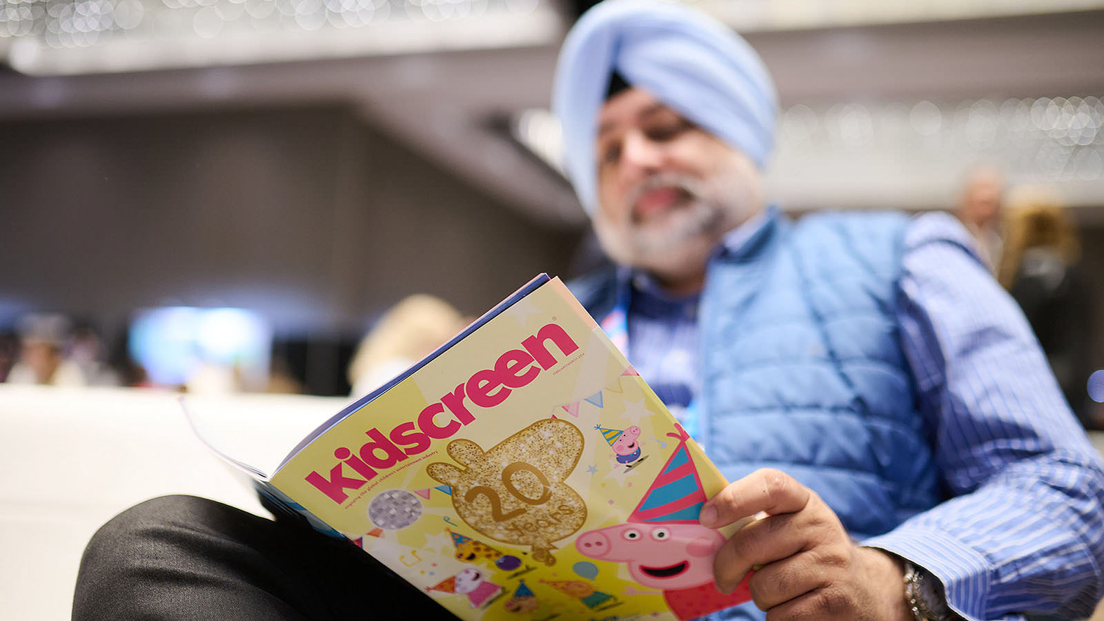 Participant immersed in the Kidscreen magazine.