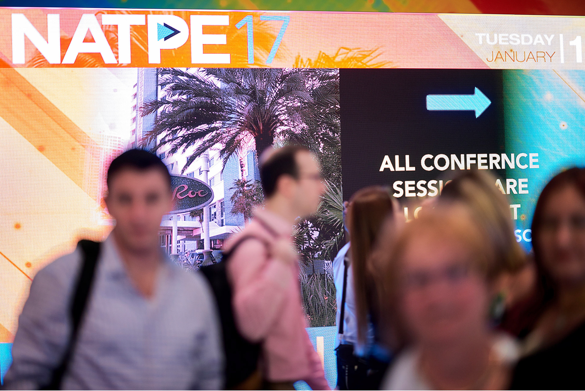 Busy exhibition area bustling with activity.