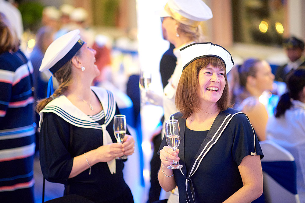 Participants having a champagne upon arrival to the party