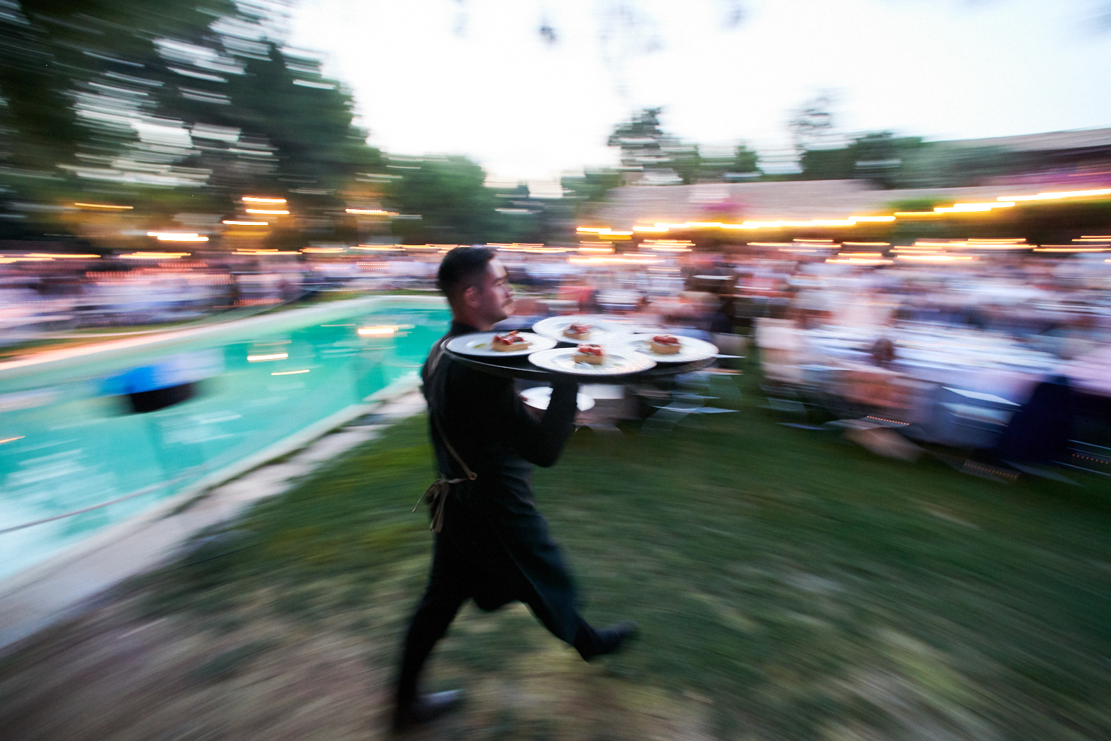 A waiter serving the dinner very fast