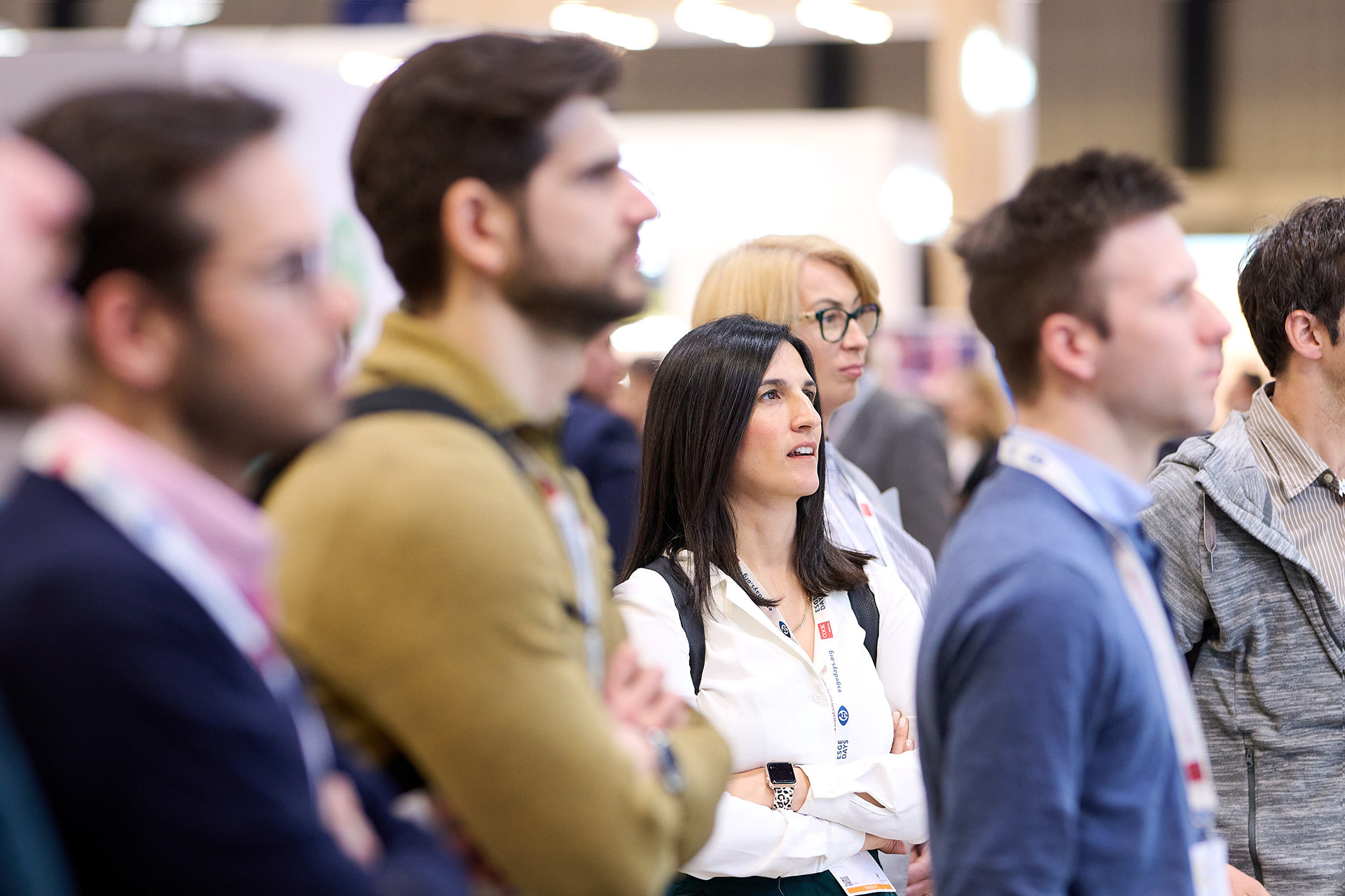 Busy exhibition floor with exhibitors and visitors at a trade fair in Berlin