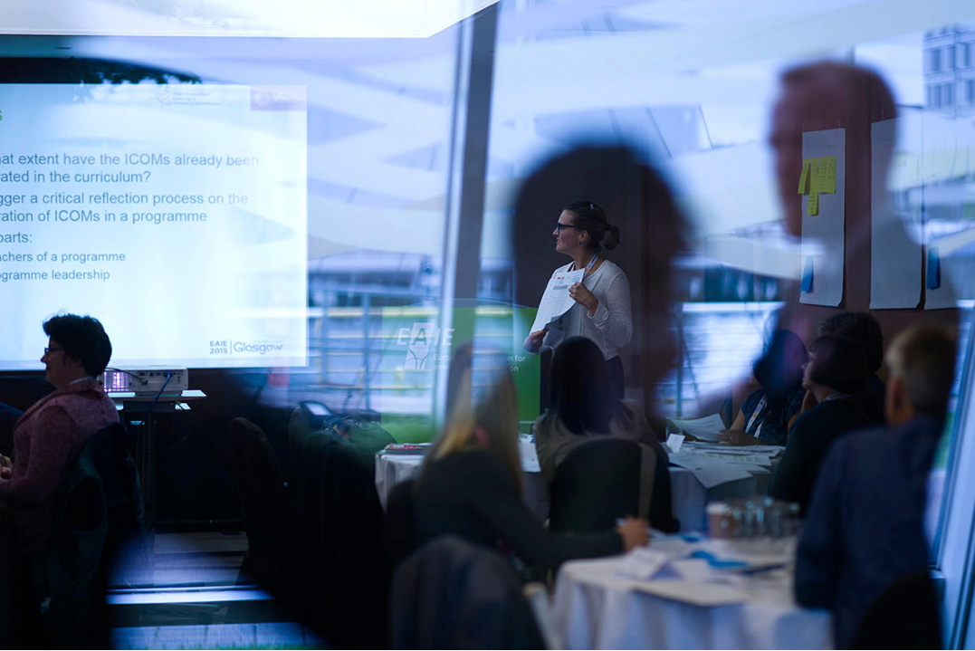 Participants listening to presentations