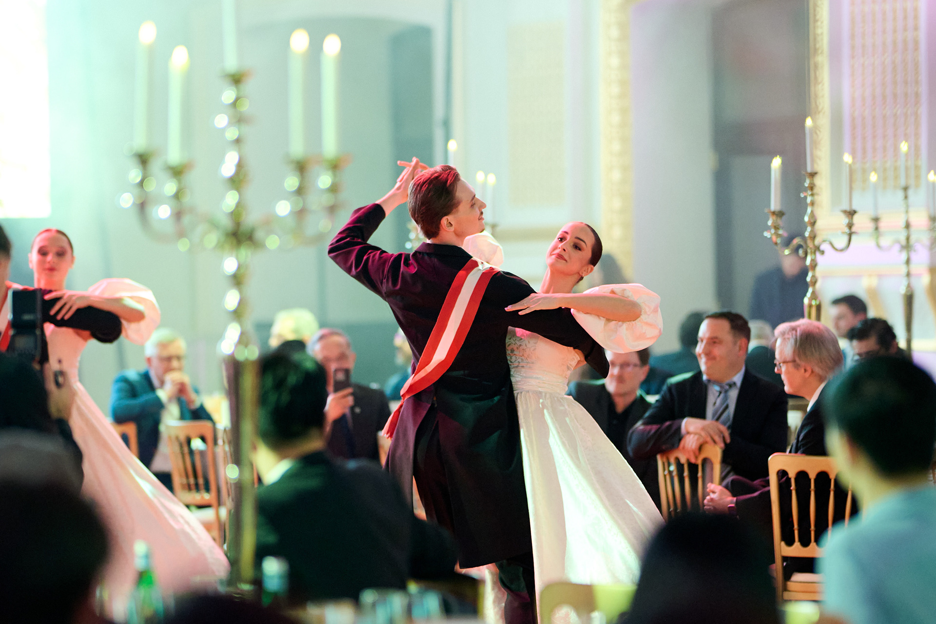 Beautifully arranged gala dinner venue with a live dance performance at Sofiensaal Vienna