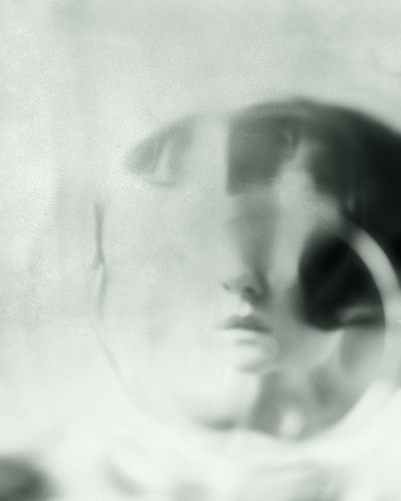The glass was cracked, but her eyes still followed whoever dared to open the cabinet
