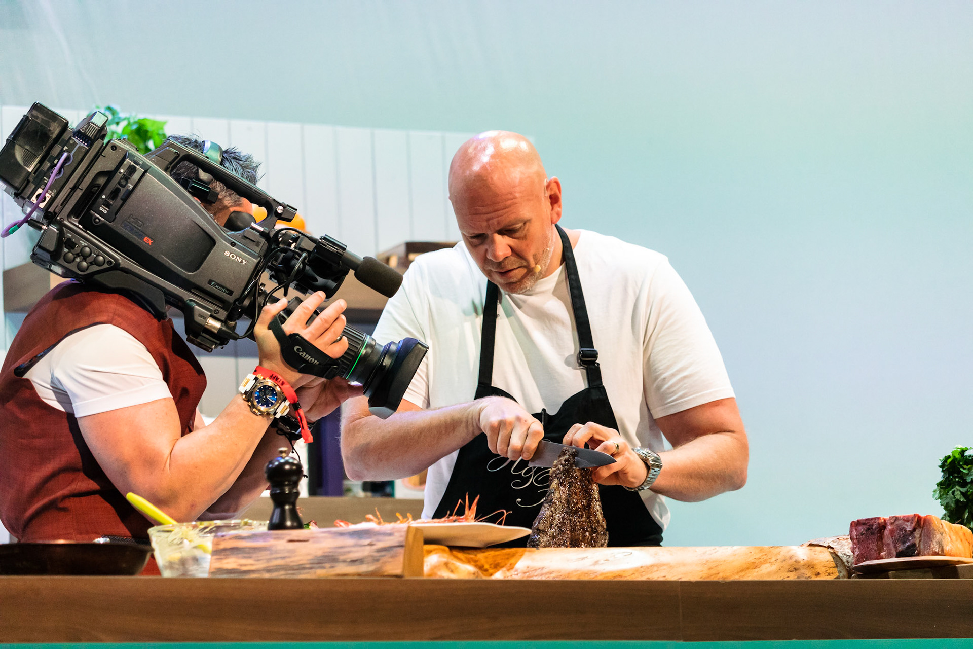 Tom Kerridge cooks T-bone steak with black pepper butter live in the Big Kitchen at BBC Good Food Show Summer, hosted by Marcus Bean, 16th June 2022