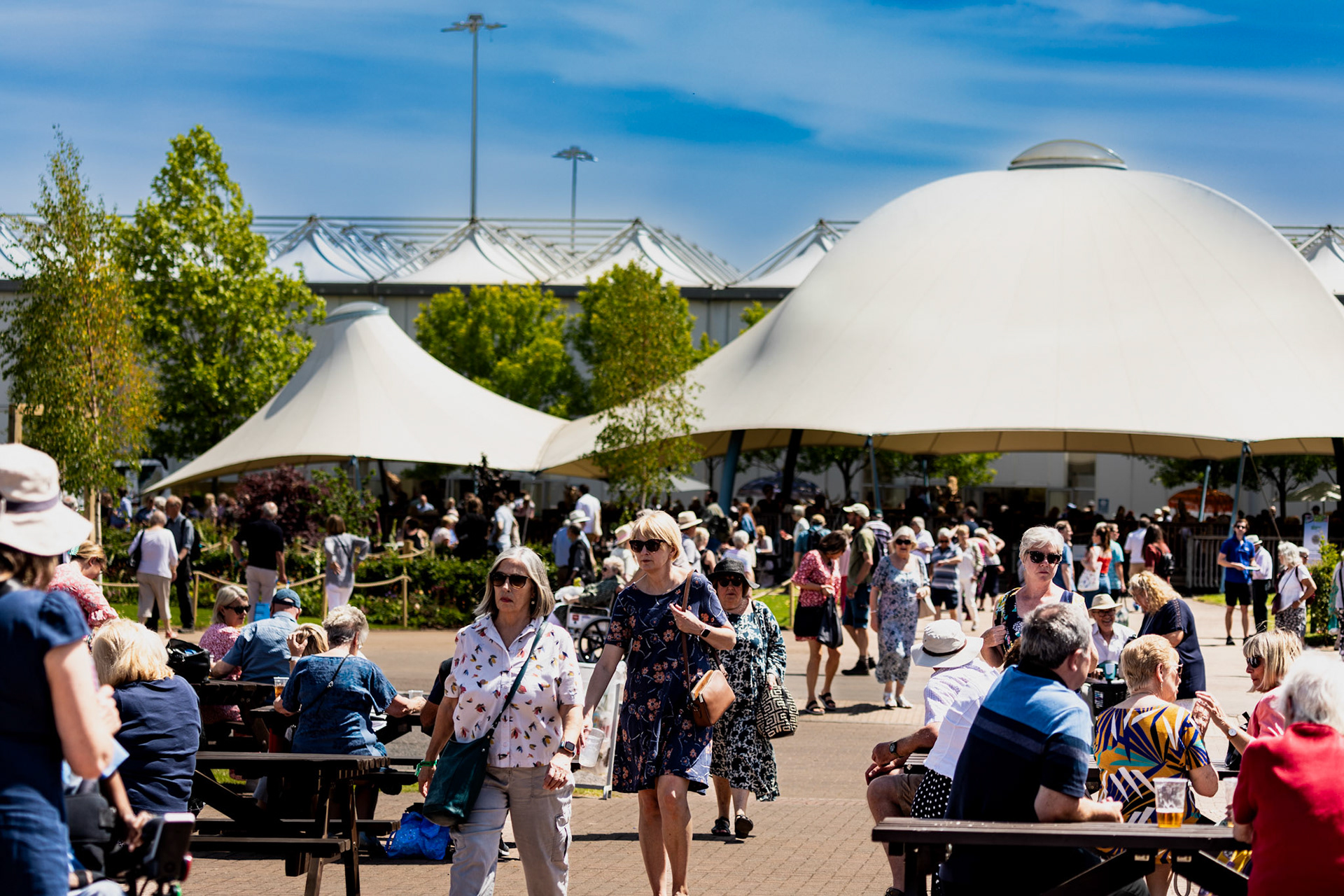 Crowds enjoy lunch in the sunshine at BBC Gardeners' World Live at the NEC, Birmingham, 16th June 2022