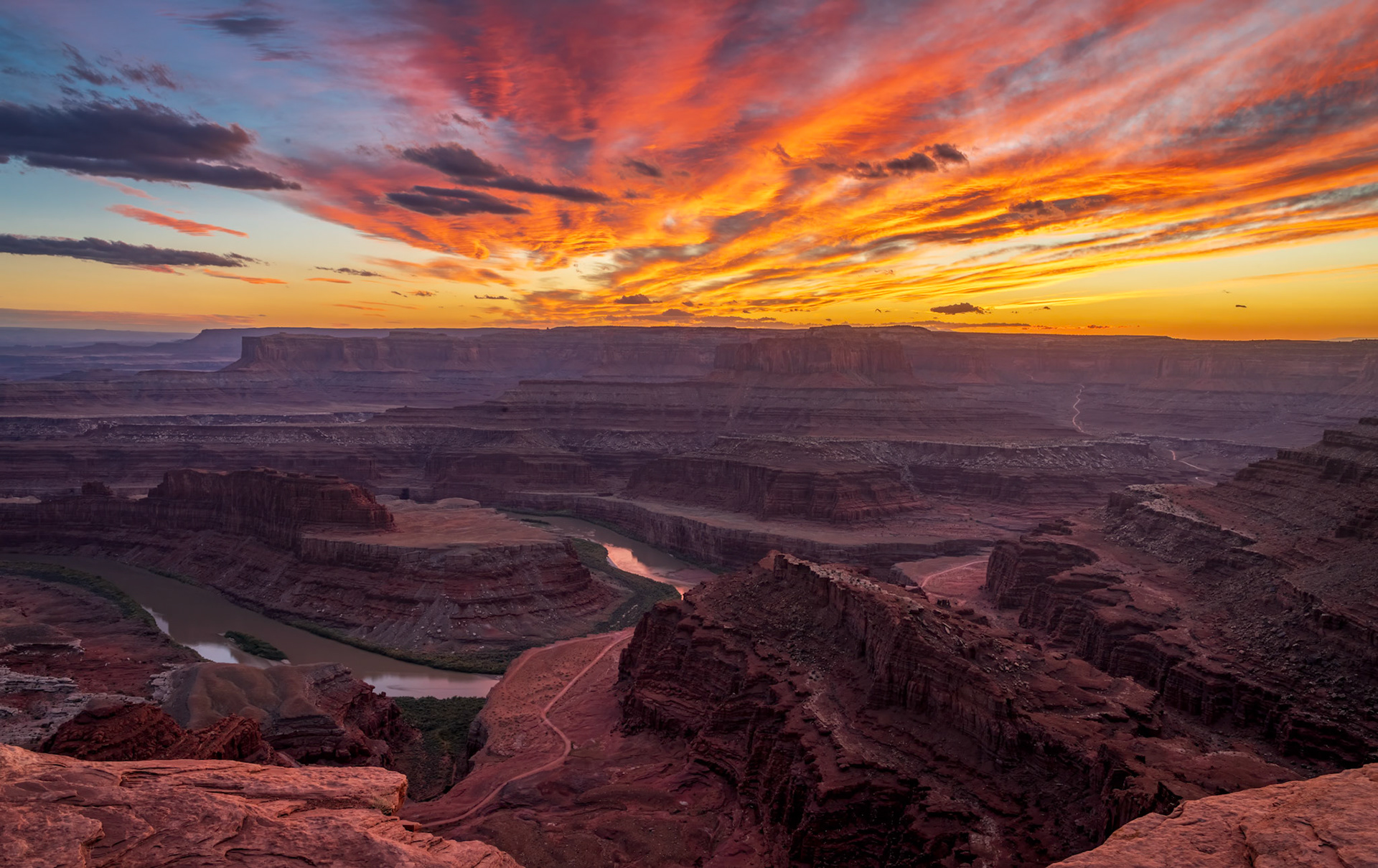 Glorious Dead Horse Point Sunset - The Colorado River meanders through its canyons as the sunset's magnificent colors spread over Dead Horse Point State Park in Utah