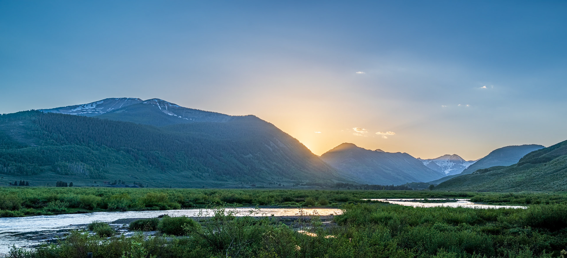Majestic Alpine Sunset - Sun setting over the Colorado Rockies and the Slate River near Crested Butte